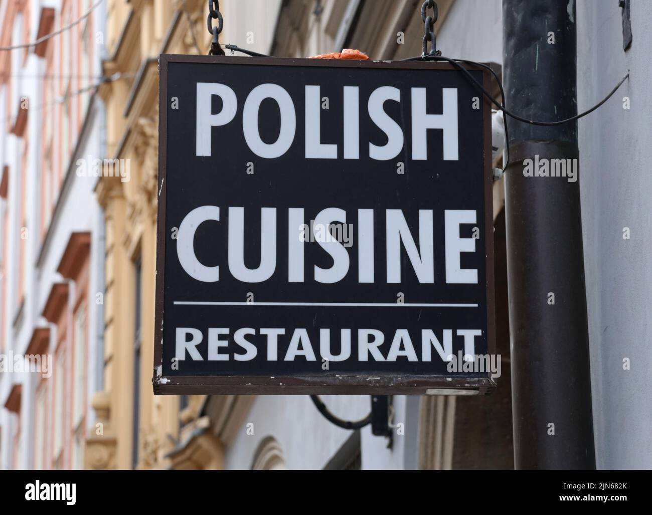 Cracow. Krakow. Poland. Polish cuisine offering restaurant signboard on the facade. Stock Photo