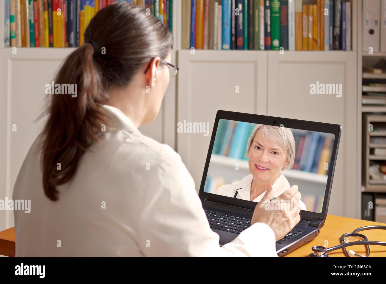 Telemedicine concept: two doctors or pharmacists during a medical video conference about examination results. Stock Photo