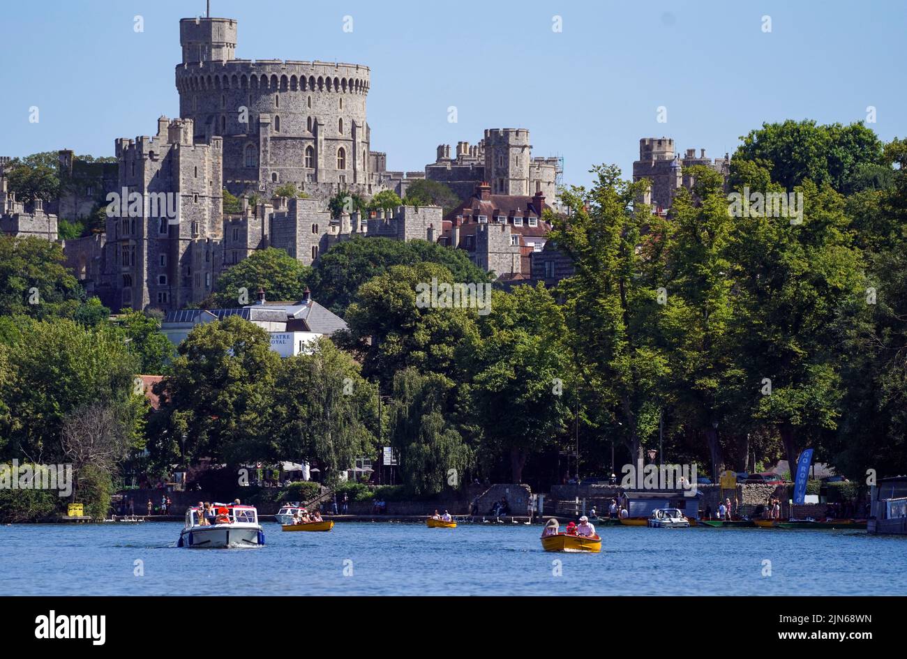 People on boats on the River Thames in Windsor, as a summer of hosepipe bans and fire warnings continues, with a heat health alert coming into place across much of the country. Picture date: Tuesday August 9, 2022. Stock Photo