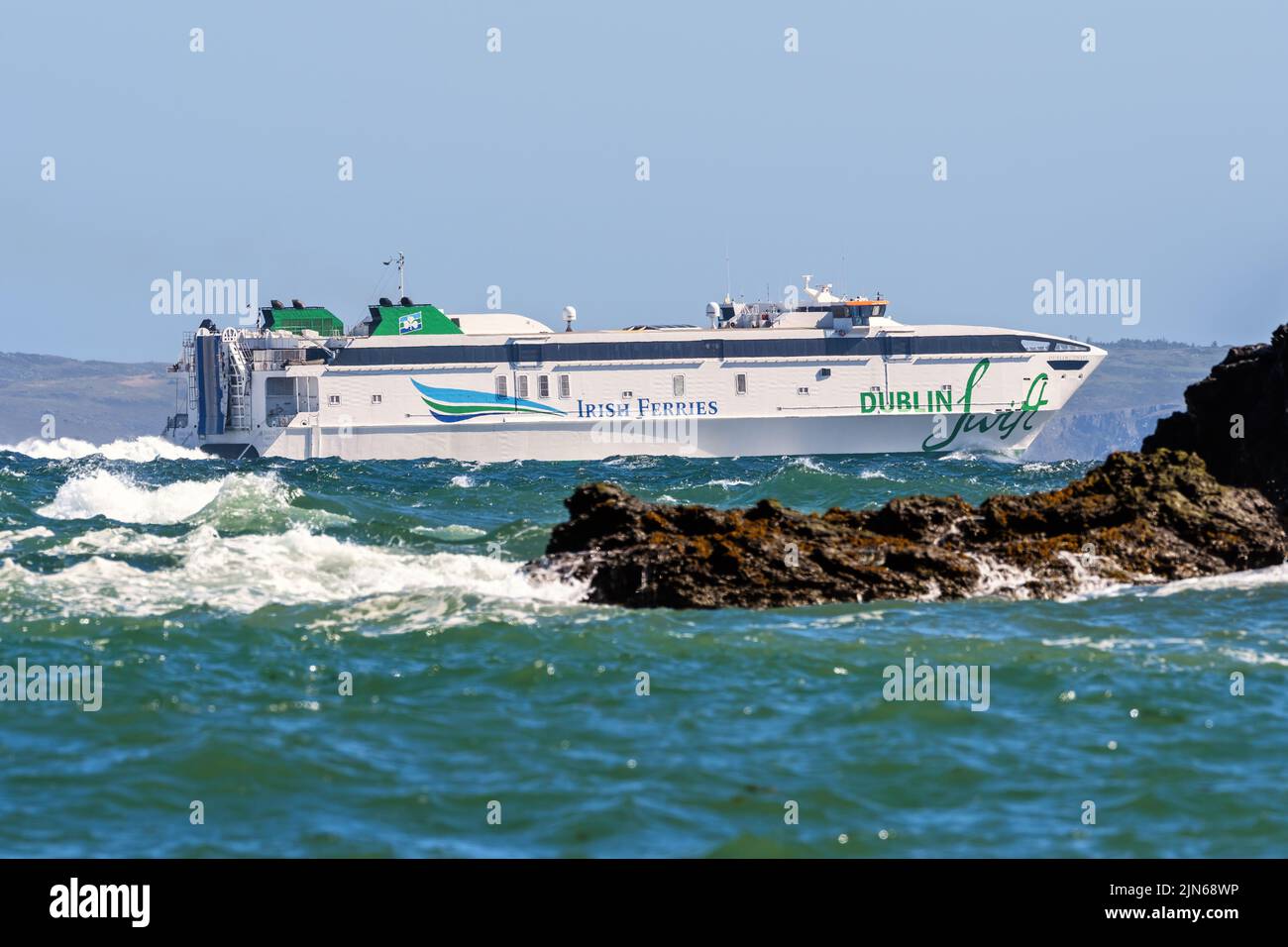 The Irish Ferries high-speed catamaran Dublin Swift arriving Holyhead after a crossing from Dublin - May 2022. Stock Photo
