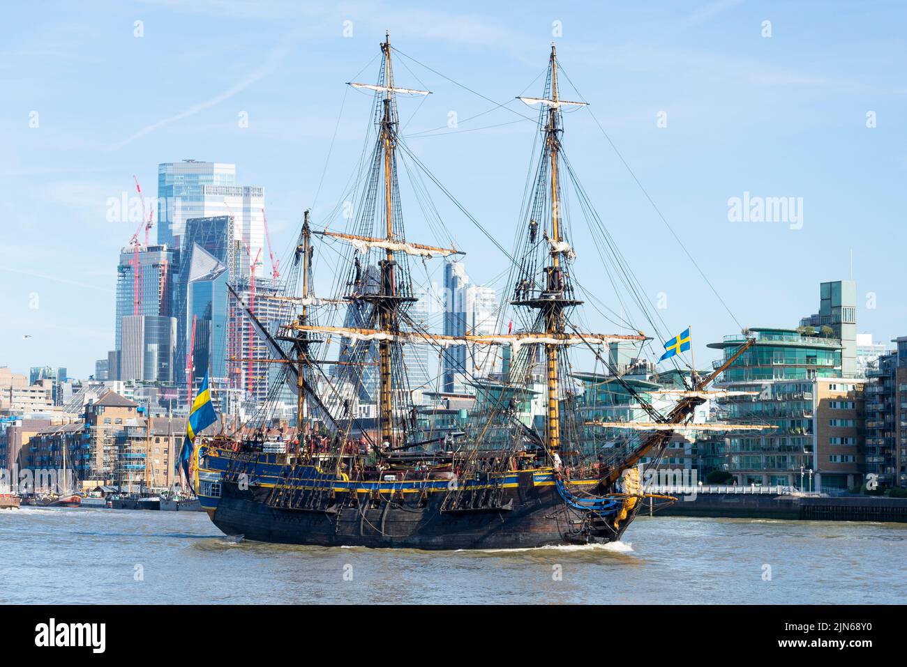 Gotheborg of Sweden, a sailing replica of the Swedish East Indiaman Gotheborg I, visiting London, UK. London city skyline, financial district Stock Photo