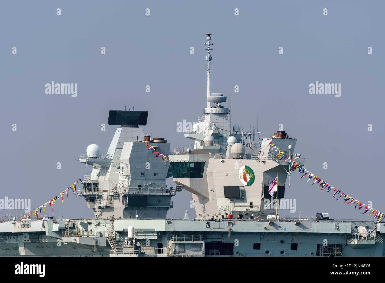 View of the Royal Navy aircraft carrier HMS Queen Elizabeth dressed overall - April 2022. Stock Photo