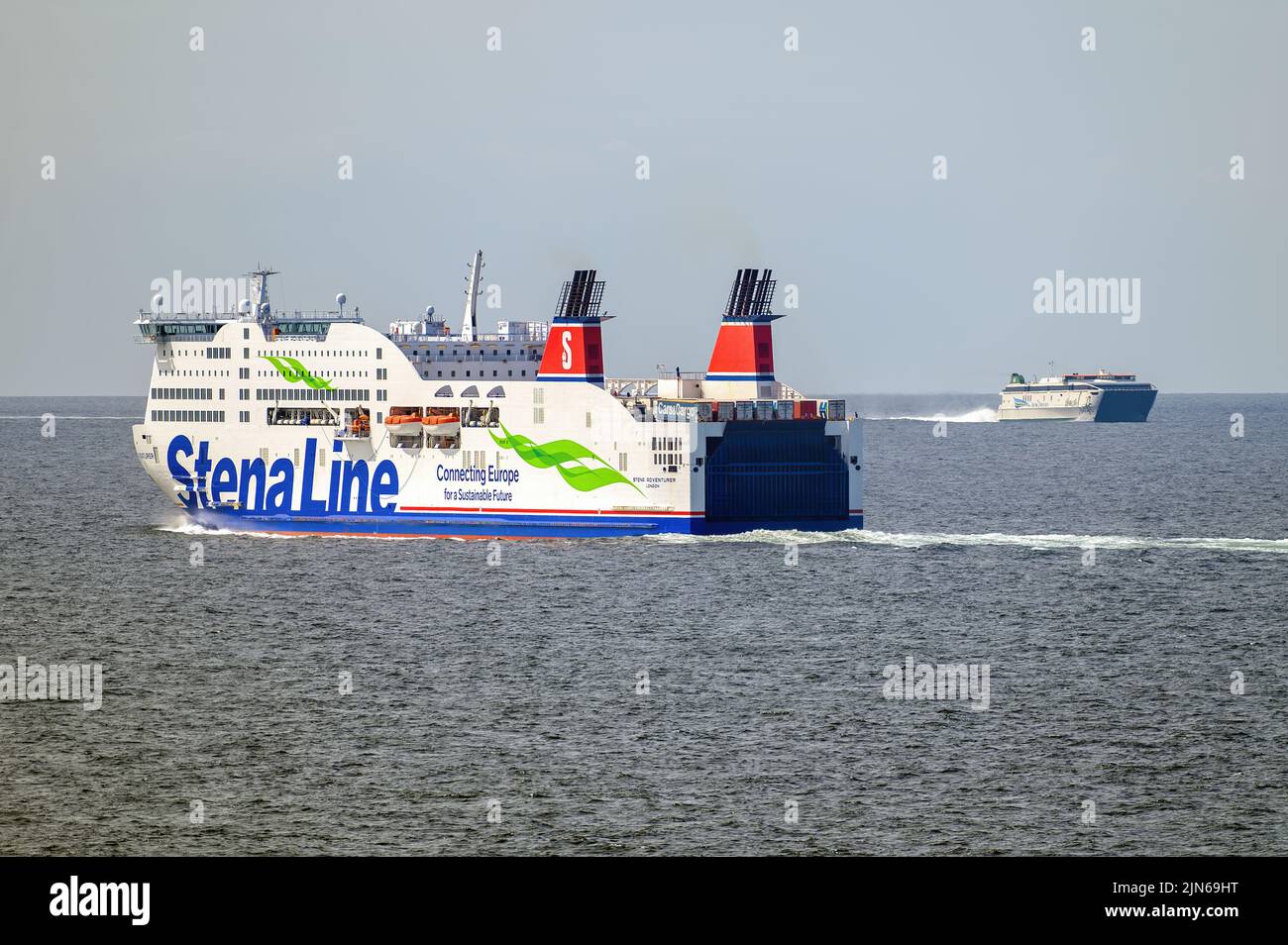 The ferries Stena Adventurer and Dublin Swift pass in the Irish Sea on the route between Holyhead and Dublin - May 2022. Stock Photo