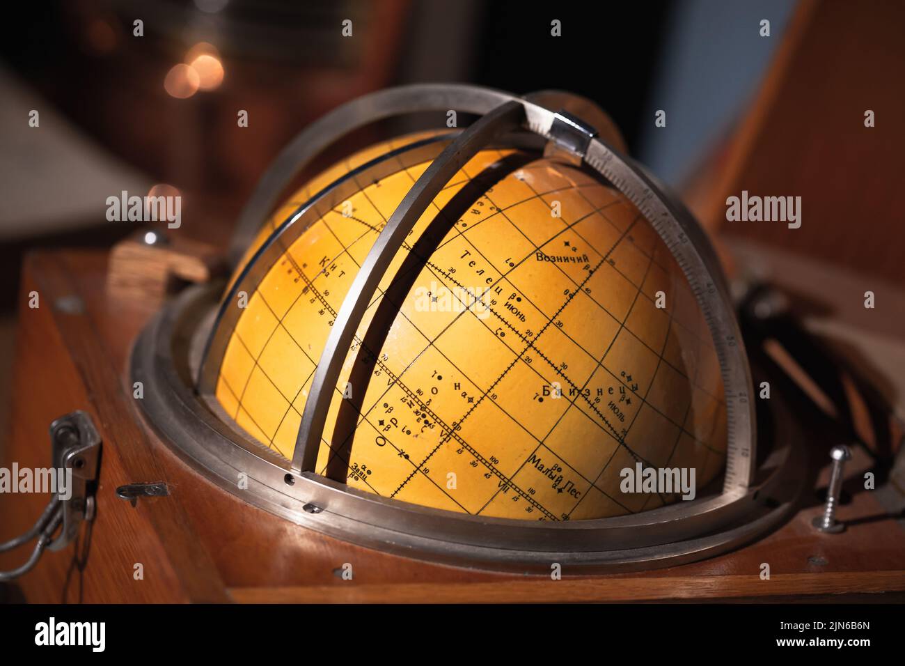 Old travel star sky globe in wooden box, vintage marine navigation equipment Stock Photo