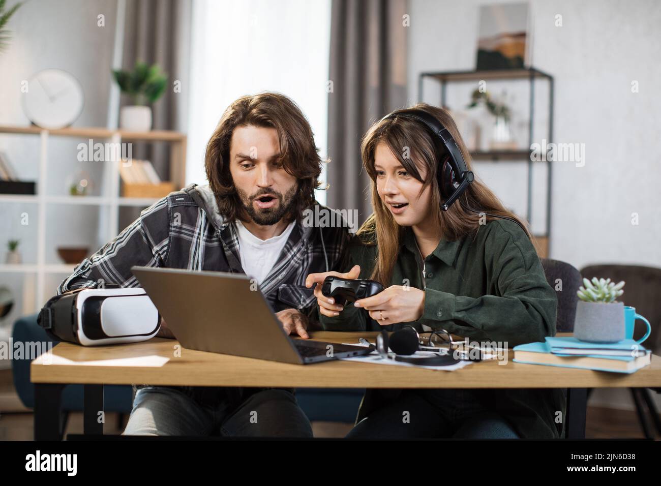 Premium Photo  Pov of young couple using console to play videogames  challenge, doing online competition on cyberspace. focused boyfriend and girlfriend  playing together to do fun leisure activity.