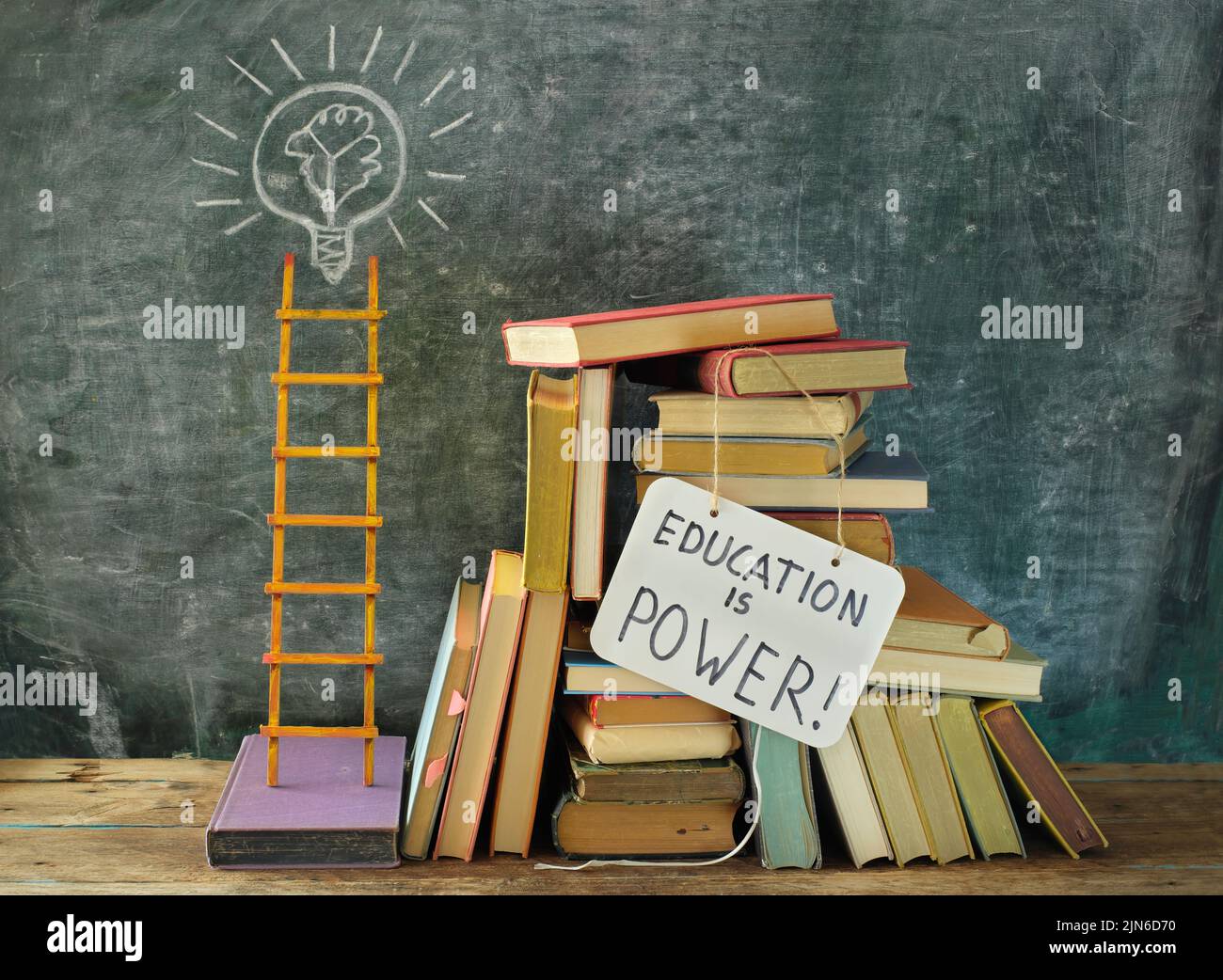 Learning,knowledge,education or back to school concept with books, education is power sign, lightbulb, idea symbol and ladder of success.Free copy spa Stock Photo