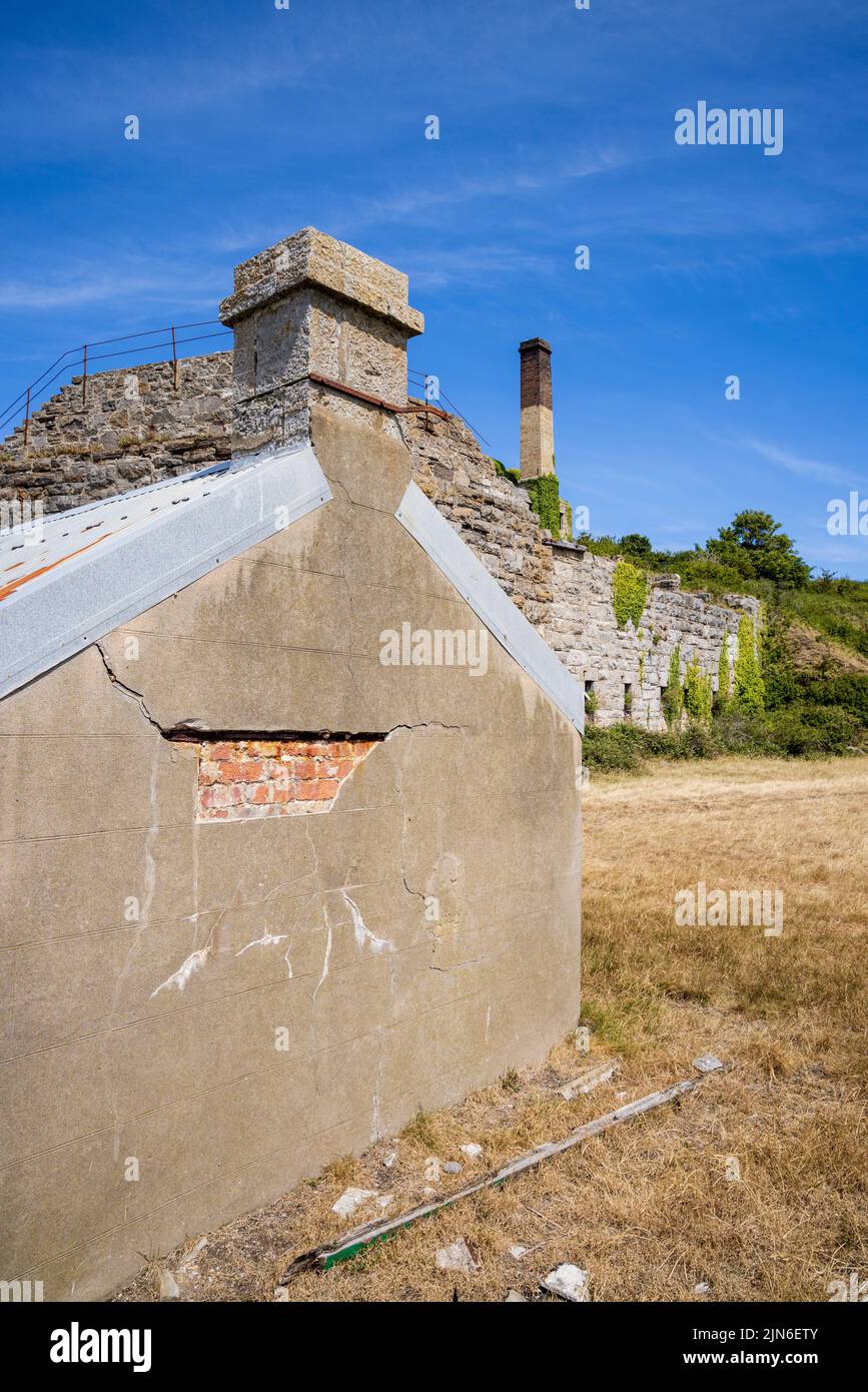 The disused Penmon Quarry buildings on the Menai Strait, Isle of Anglesey, North Wales Stock Photo