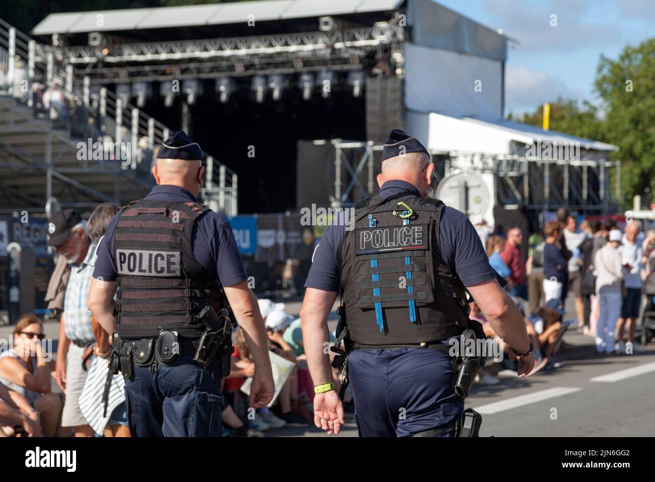 Quimper, France - July 24 2022: Two officers of the Police Nationale patrolling the city center during the Cornouaille festival. Stock Photo