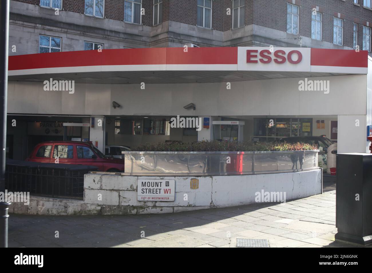 Legendary filling station on the corner of Park Lane and Mount street in London. Built in into the living house in downtown, it offers good service Stock Photo