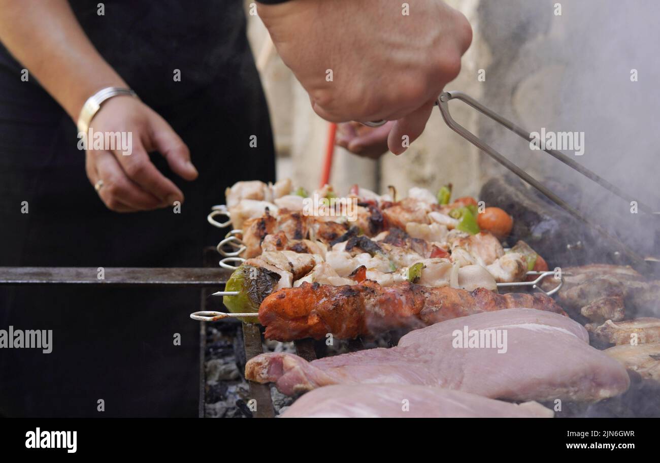 different types of grilled meat and vegetables Stock Photo