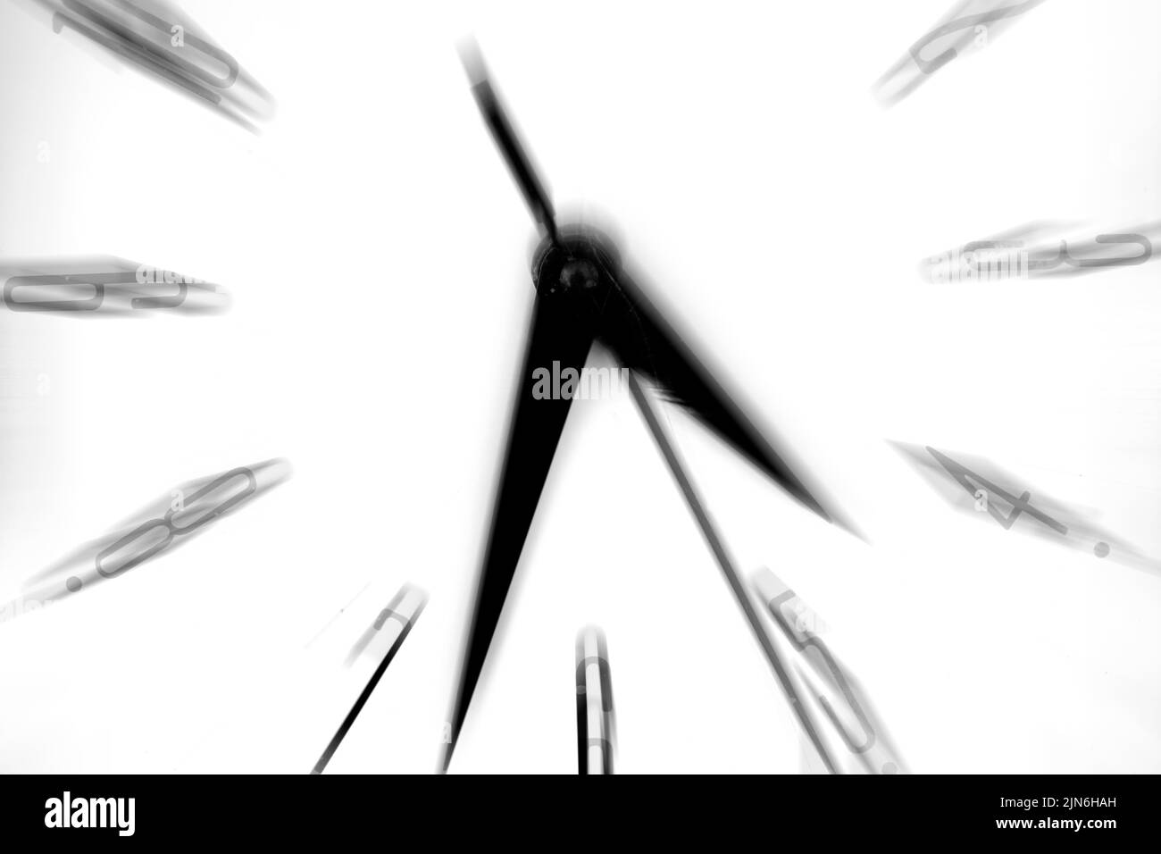 Clock showing time speeding away motion movement Stock Photo