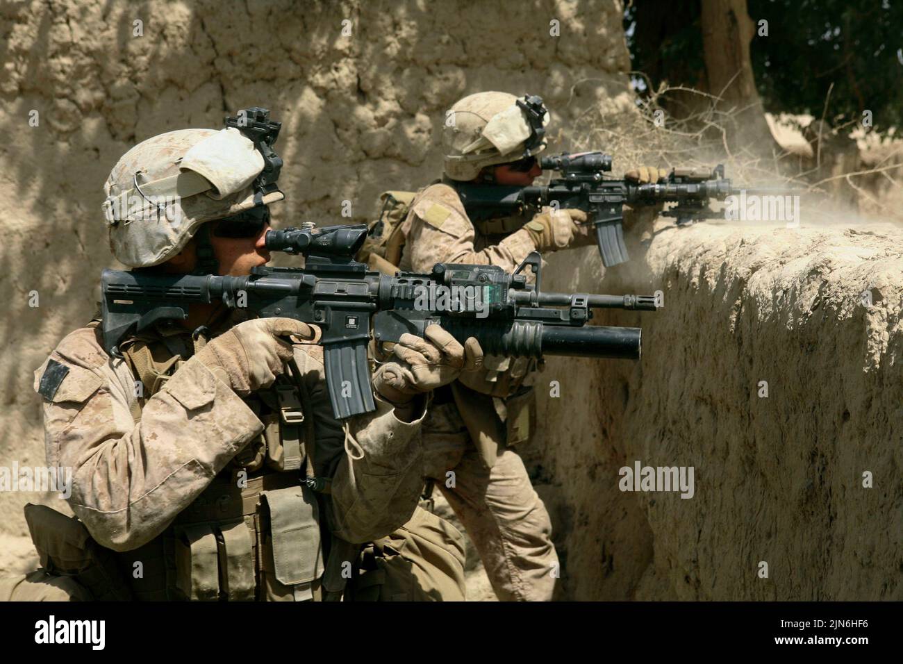 NEAR HASAAN ABAD, HELMAND PROVINCE, AFGHANISTAN - 03 July 2009 - US Marines Sgt Ryan Pettit, left, and Cpl. Matthew Miller, from 2nd Battalion, 8th Ma Stock Photo