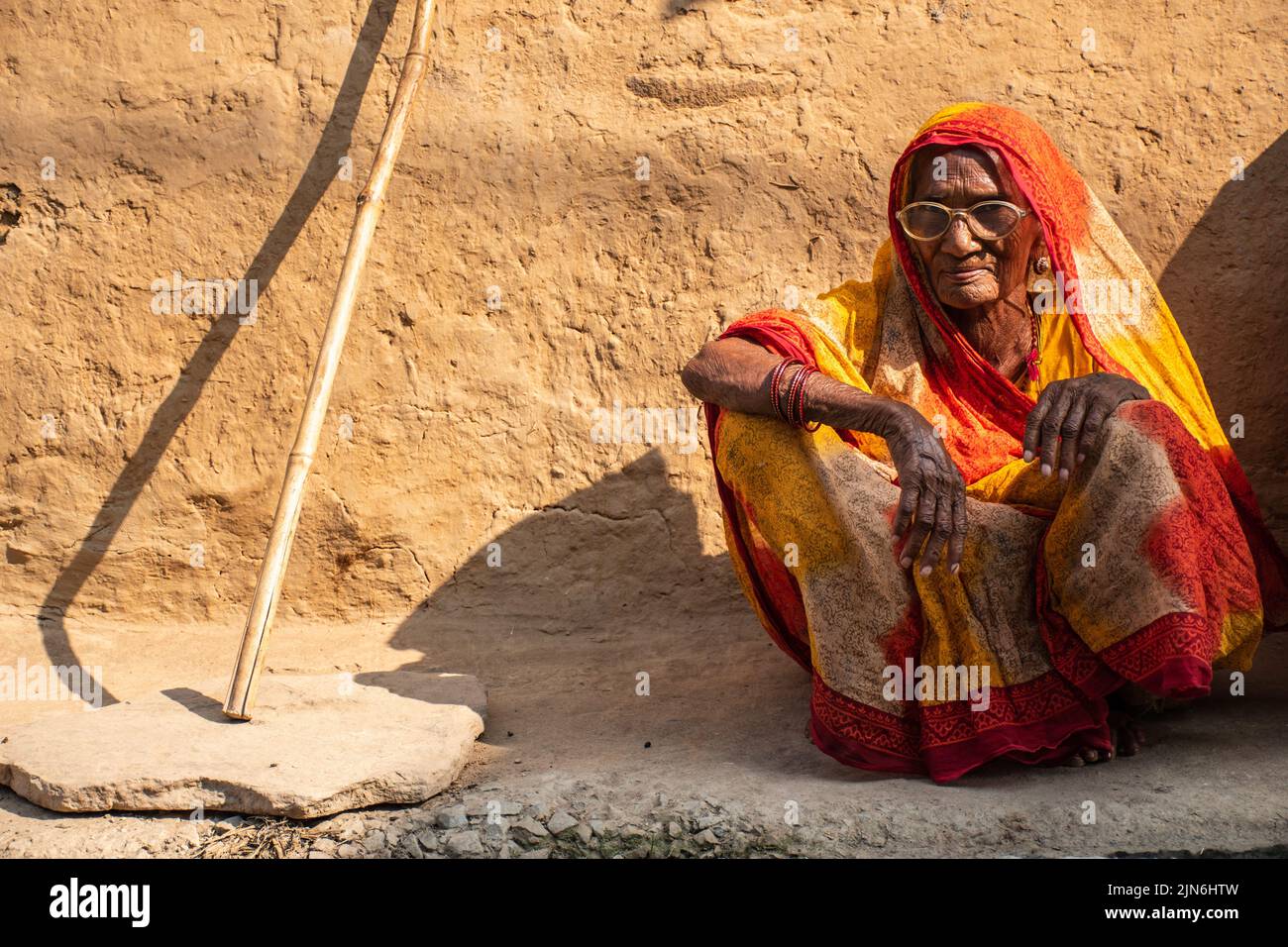 The womens live in the Soil house wait for help because of hunger in India. Stock Photo