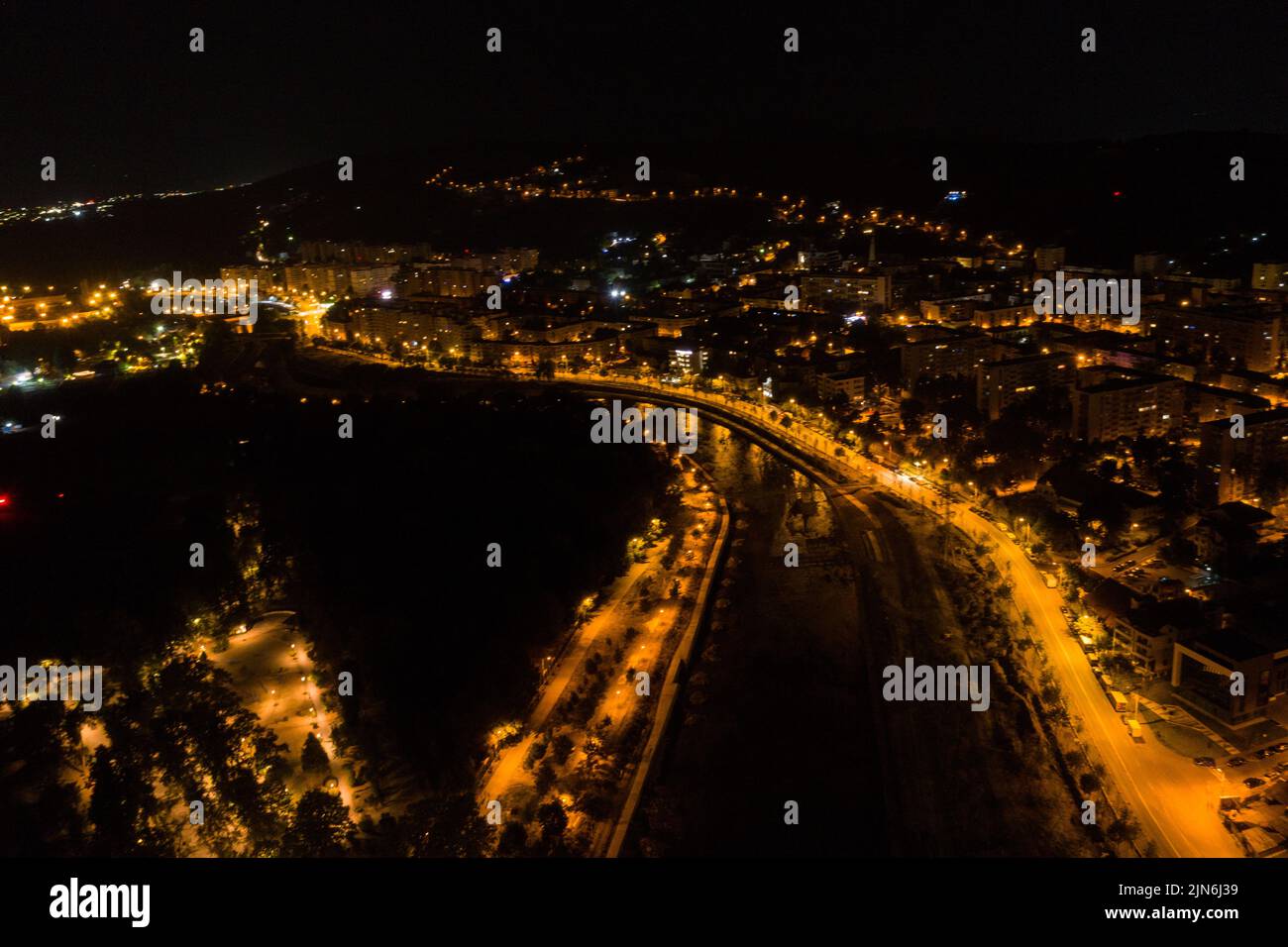Aerial view of Cluj Napoca city by night. Urban landscape with illuminated streets, Romania Stock Photo
