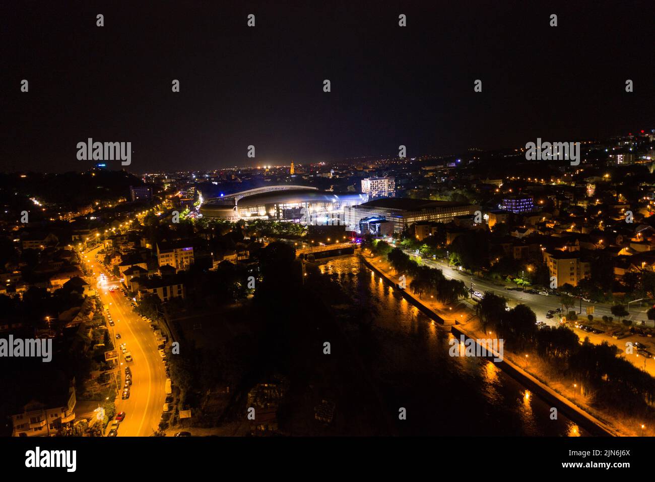 Aerial view of Cluj Napoca city by night. Urban landscape with illuminated streets, Romania Stock Photo