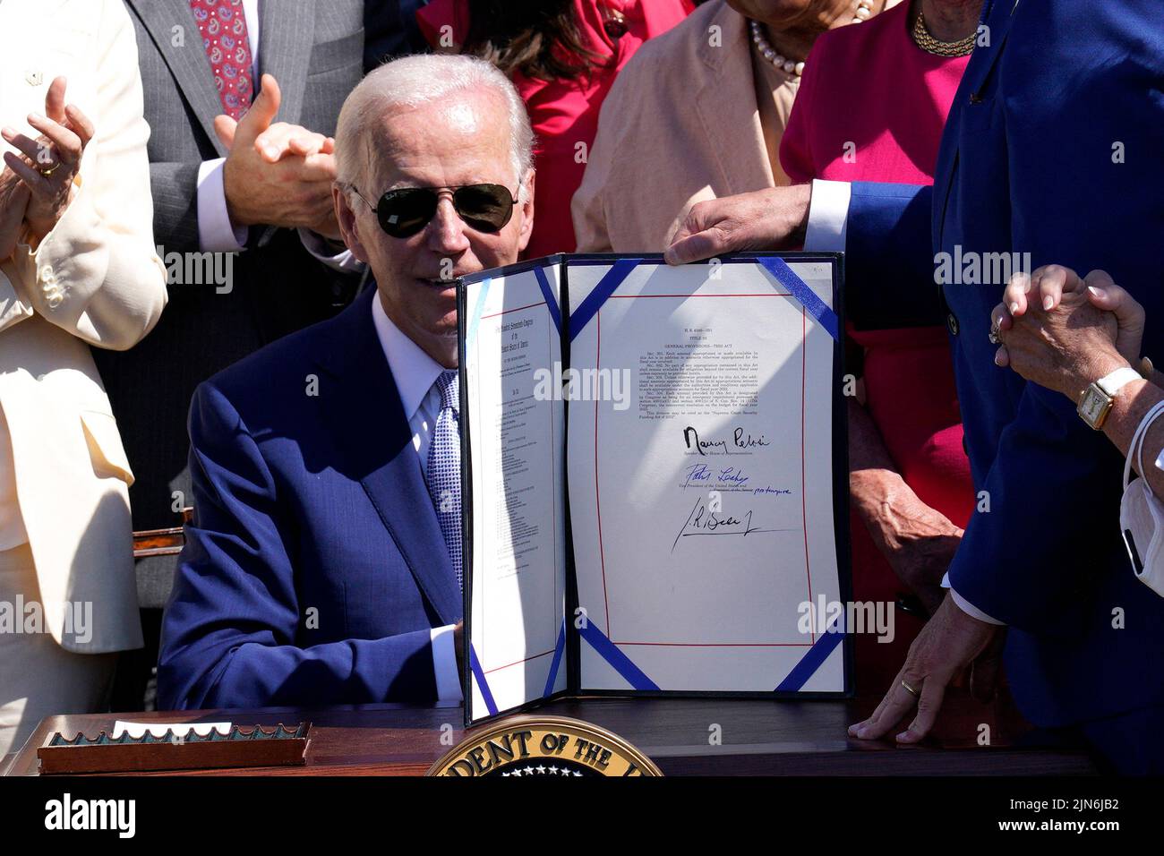 U.S. President Joe Biden signs into law the CHIPS and Science Act ...