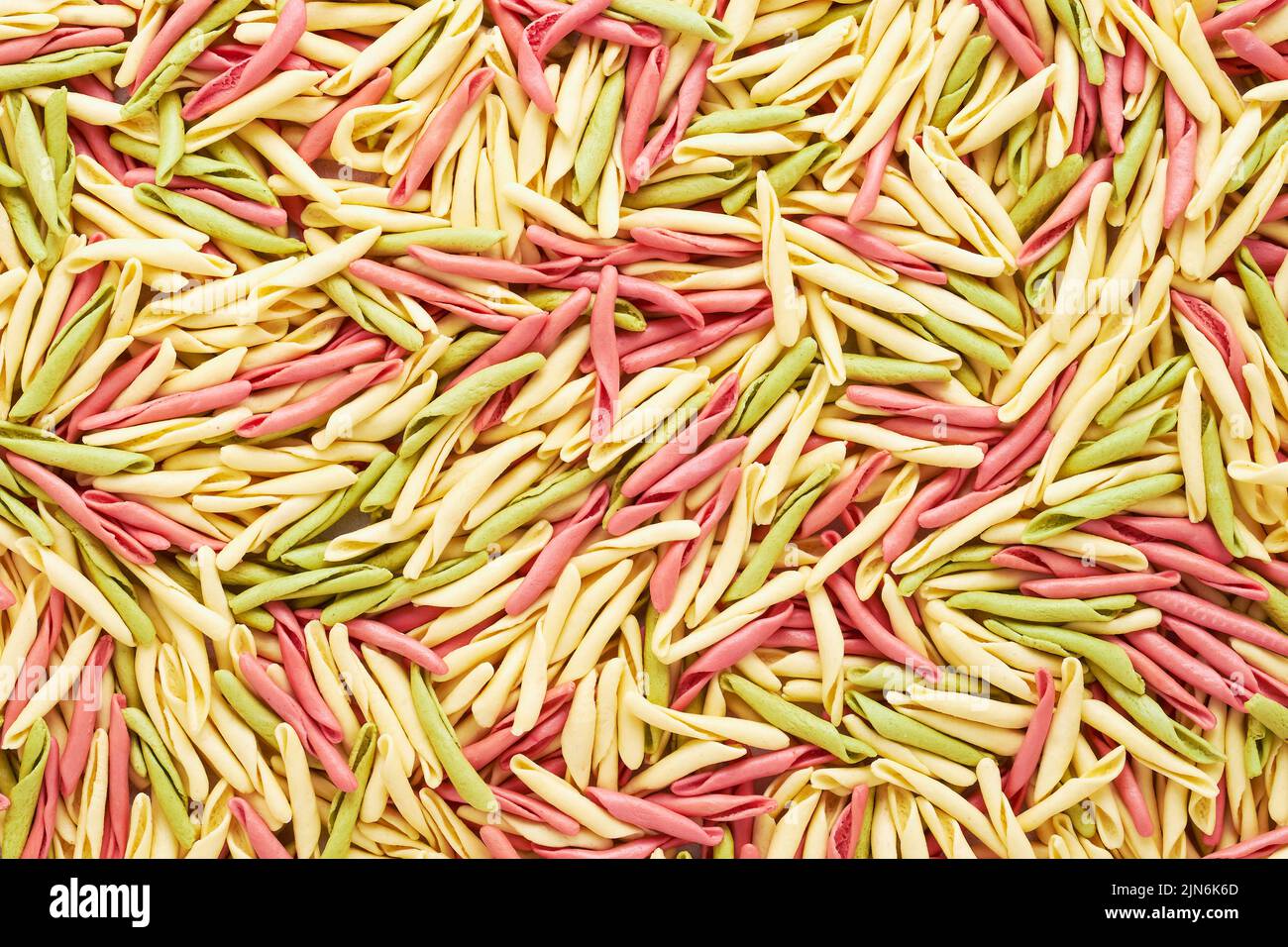 Food background. Colorful short twisted pasta from Liguria. Stock Photo