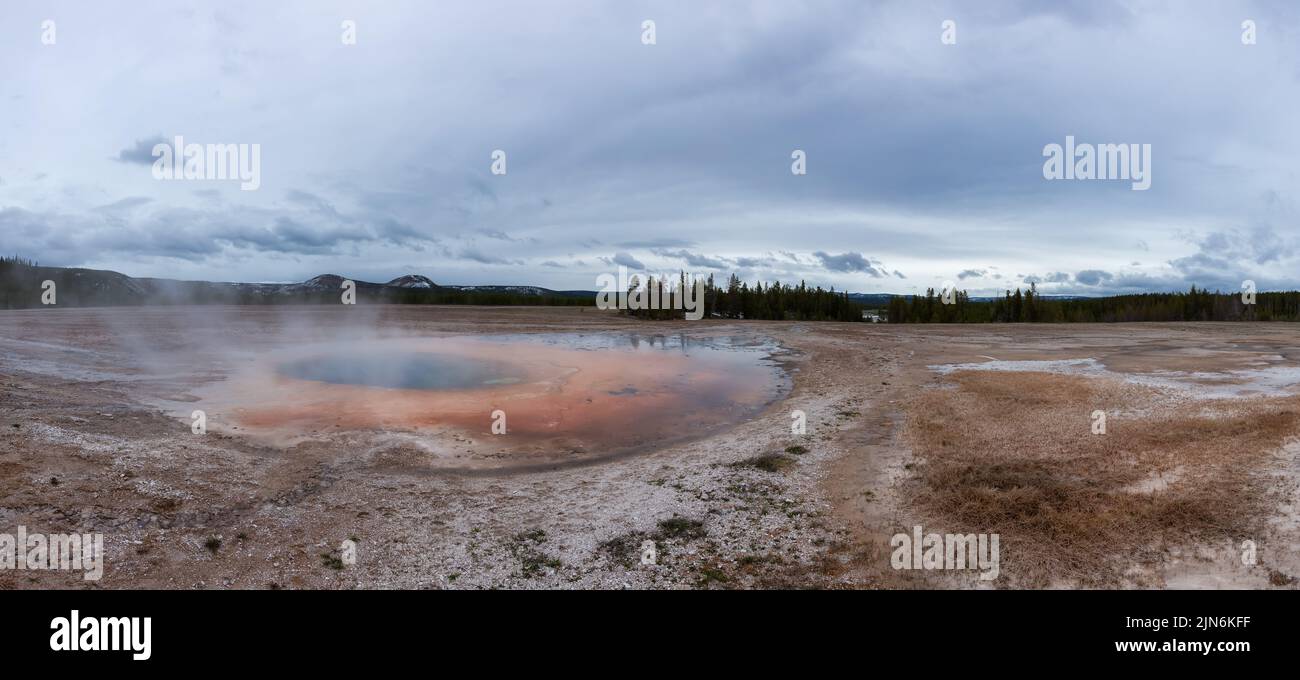 Hot spring Geyser with colorful water in American Landscape. Stock Photo