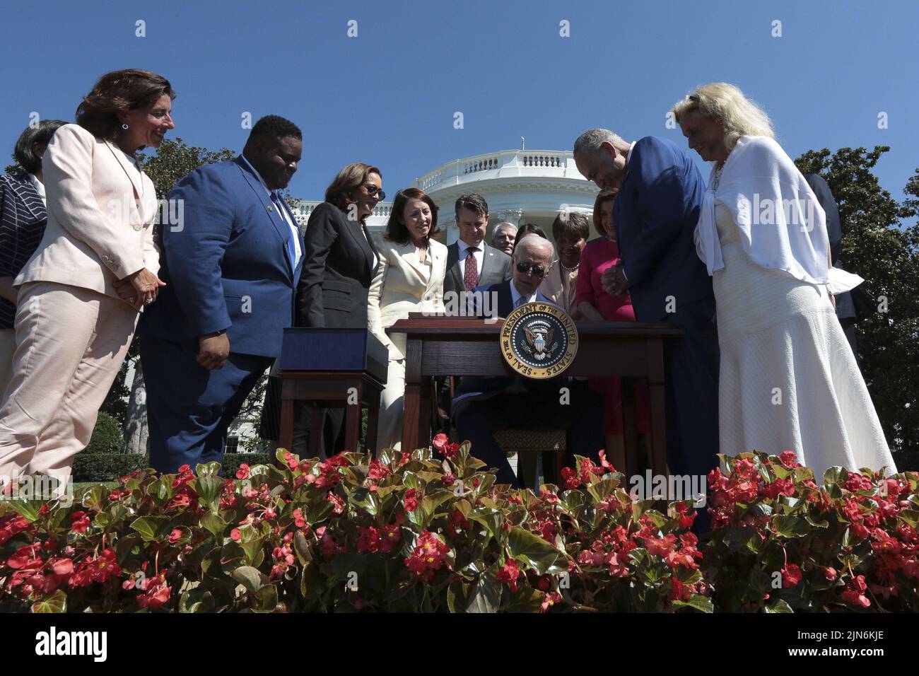 Washington, United States. 09th Aug, 2022. President Joe Biden, center