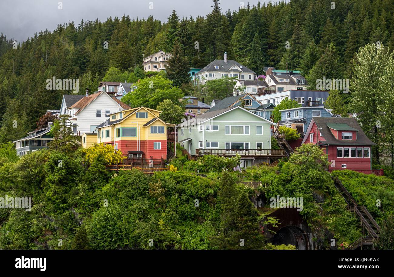 Colorful wooden homes and houses on the hillside above the harbor in Ketchikan Alaska Stock Photo