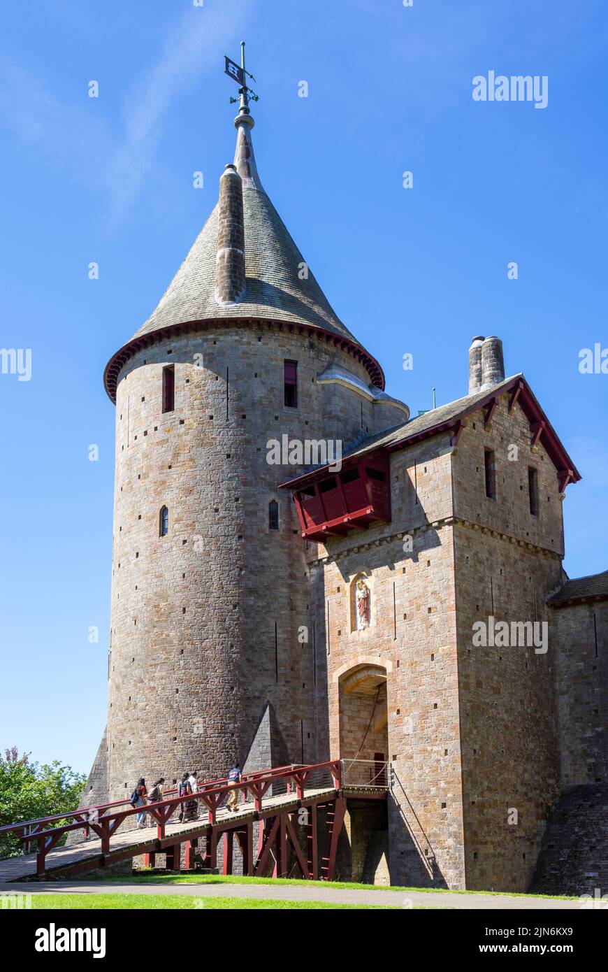 Tourists walking up the castle drawbridge towards Castell Coch Castle Coch or Red Castle Tongwynlais Cardiff South Wales UK GB Europe Stock Photo