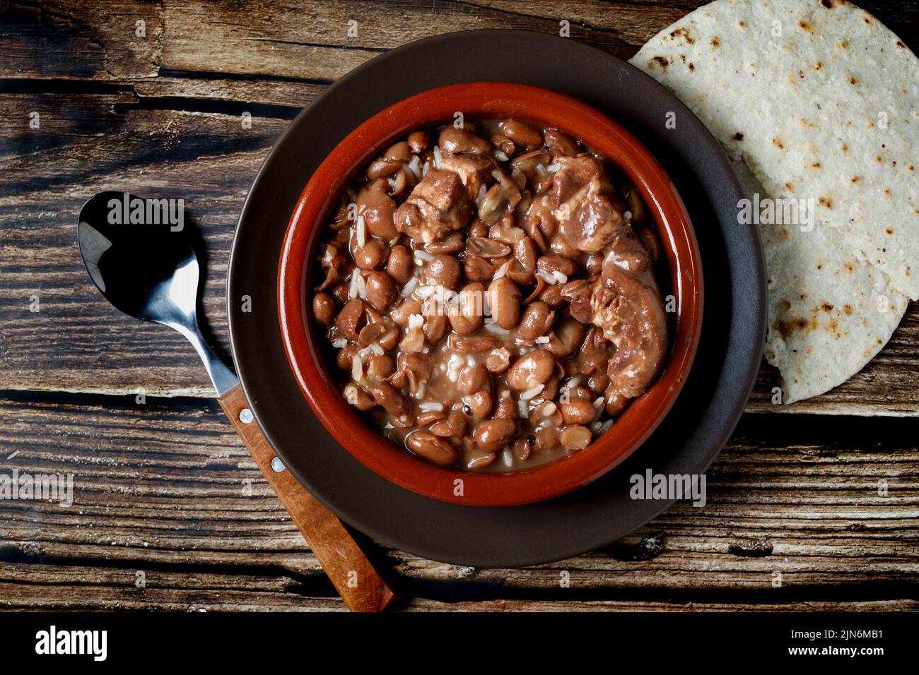 Black bean stew in clay pot Stock Photo