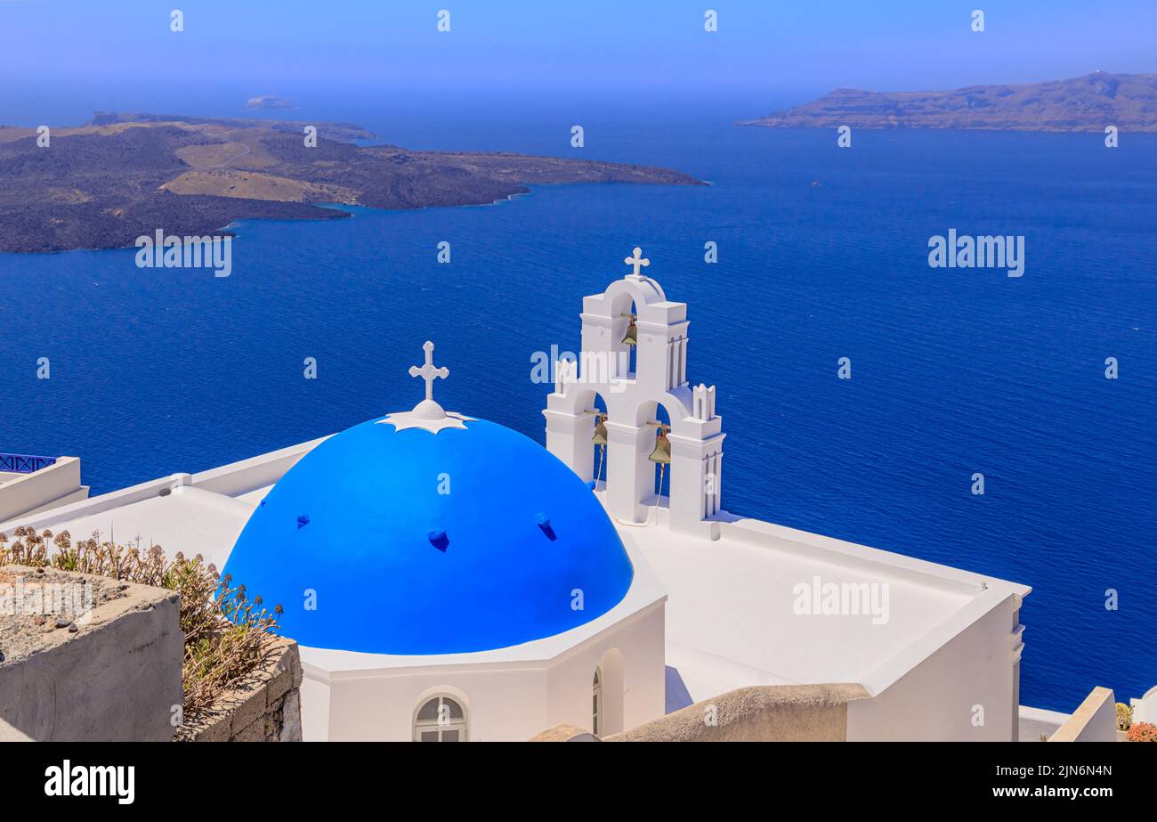 Three Bells of Fira, a Greek Catholic church in Fira, Santorini, Greece. Stock Photo