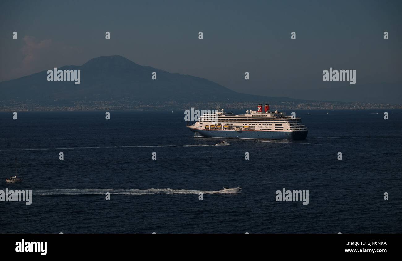 A view of the Bay of Naples with the Fred Olsen cruise liner Bolette moored off the coast of Sorrento. Stock Photo