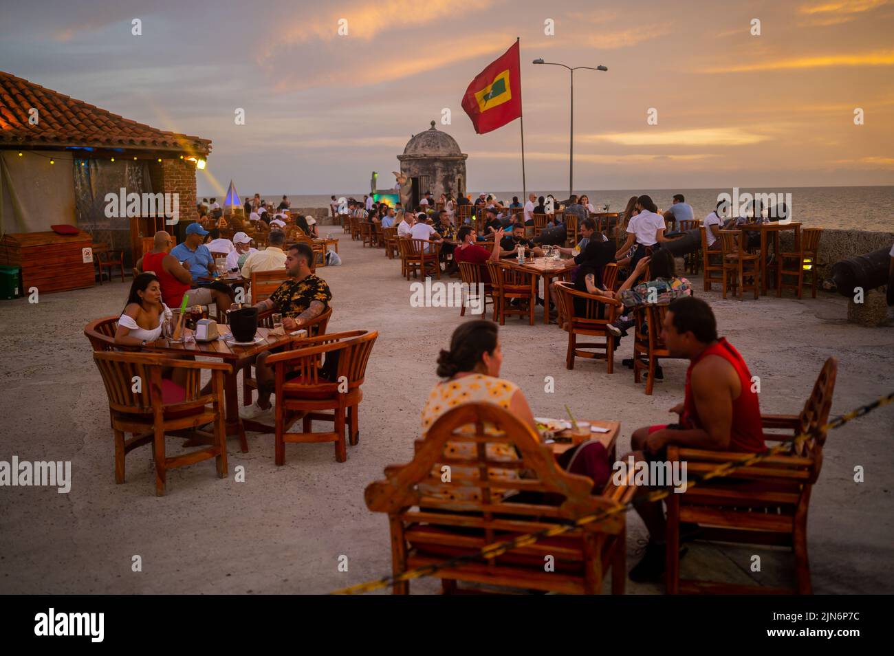 Beautiful sunset from popular Cafe del Mar lounge bar atop Baluarte Santo Domingo in old walled city of Cartagena, Colombia Stock Photo