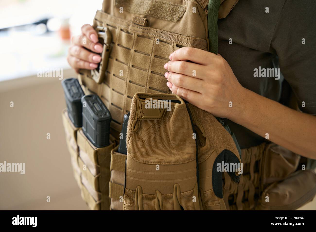 Woman wearing camouflage military uniform hi-res stock photography and ...