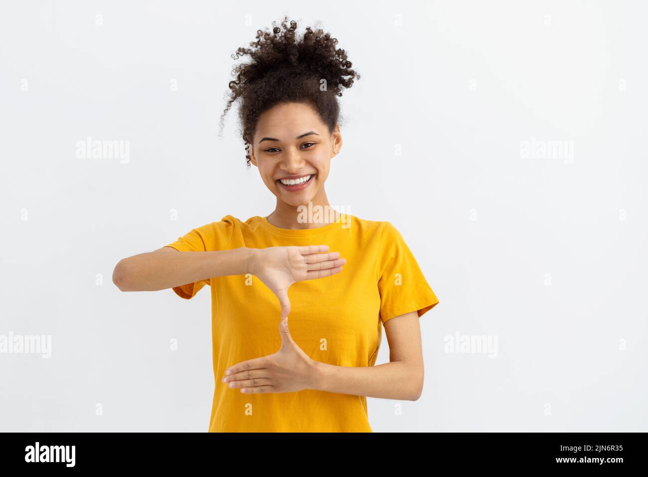 Deaf mute young African American woman white background Stock Photo