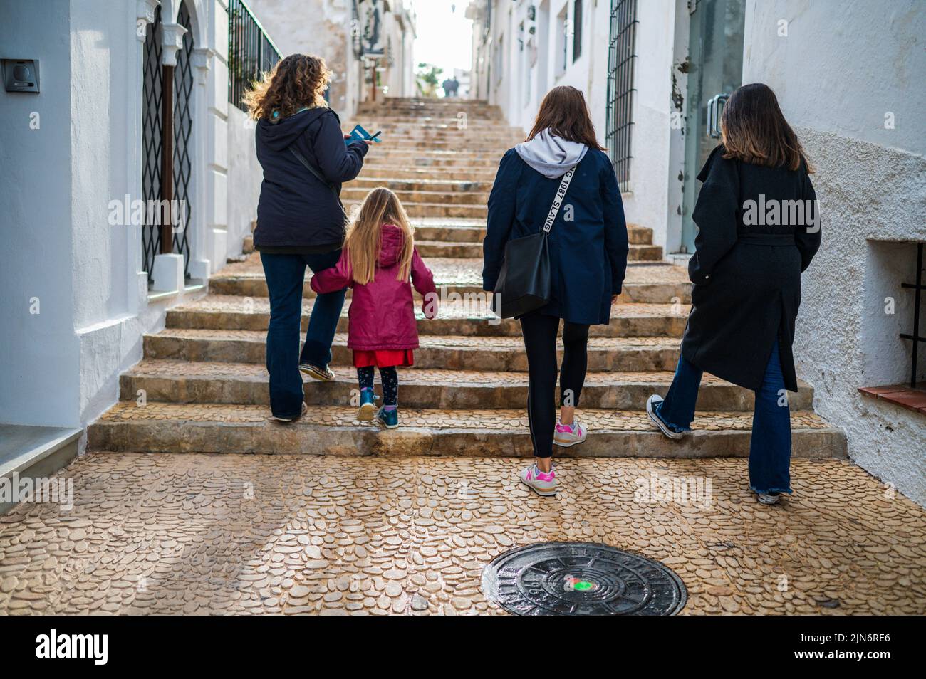 Family walks in the streets of Altea, Alicate, Spain Stock Photo