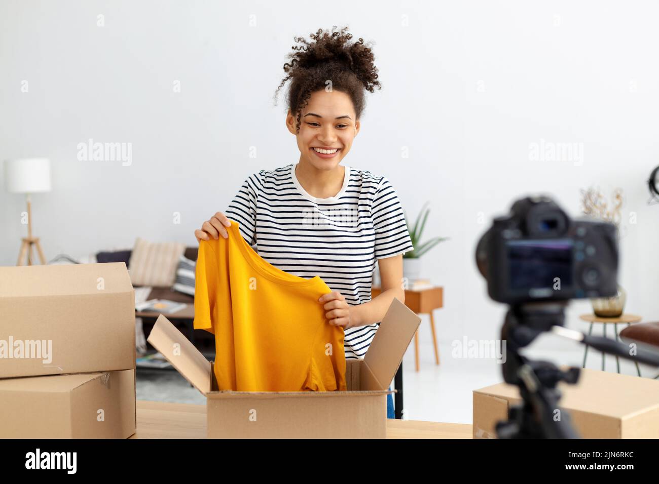 female vlogger freelancer using camera to recording video content makes Stock Photo