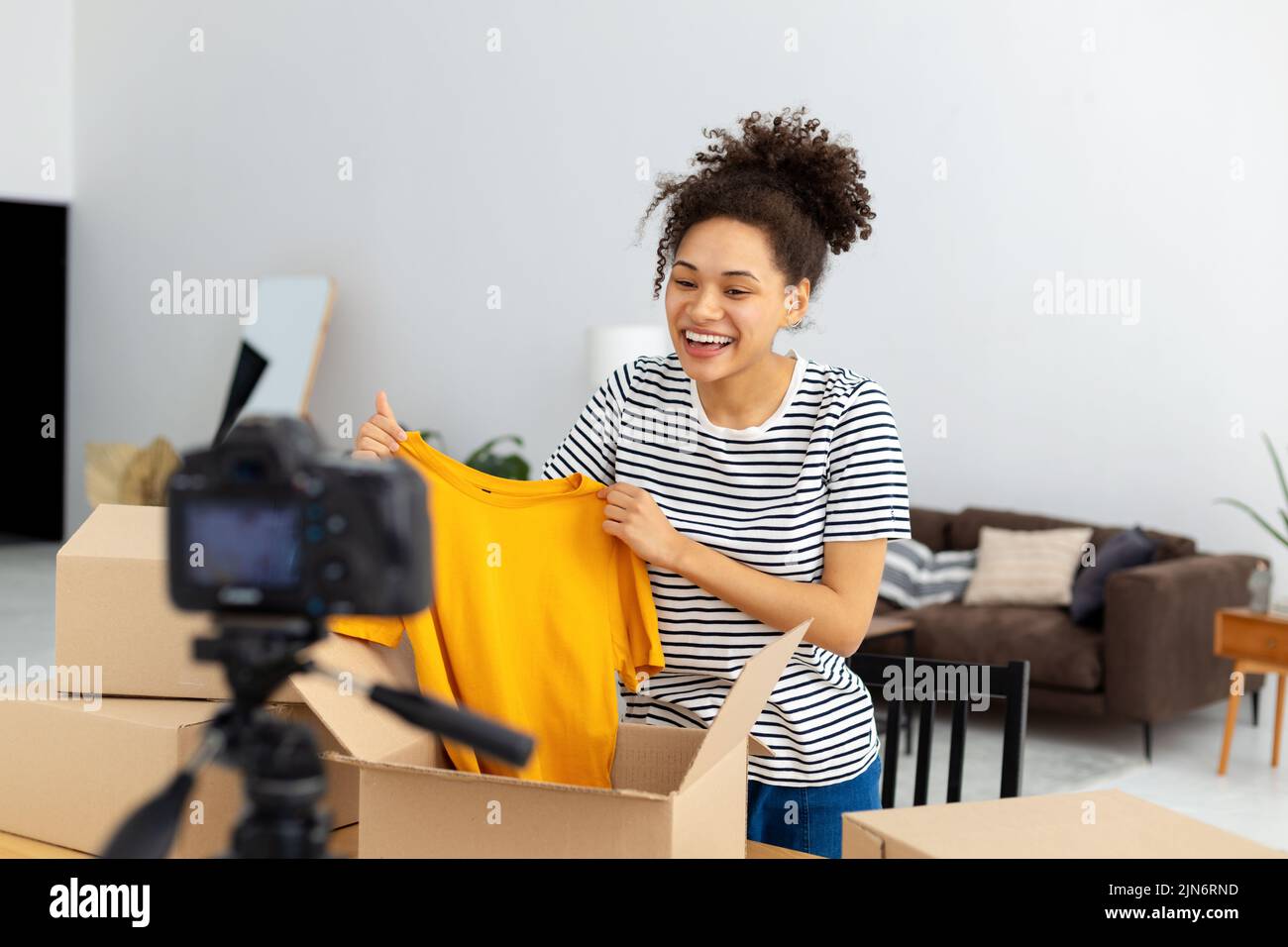 African American female vlogger freelancer using camera to recording video content Stock Photo