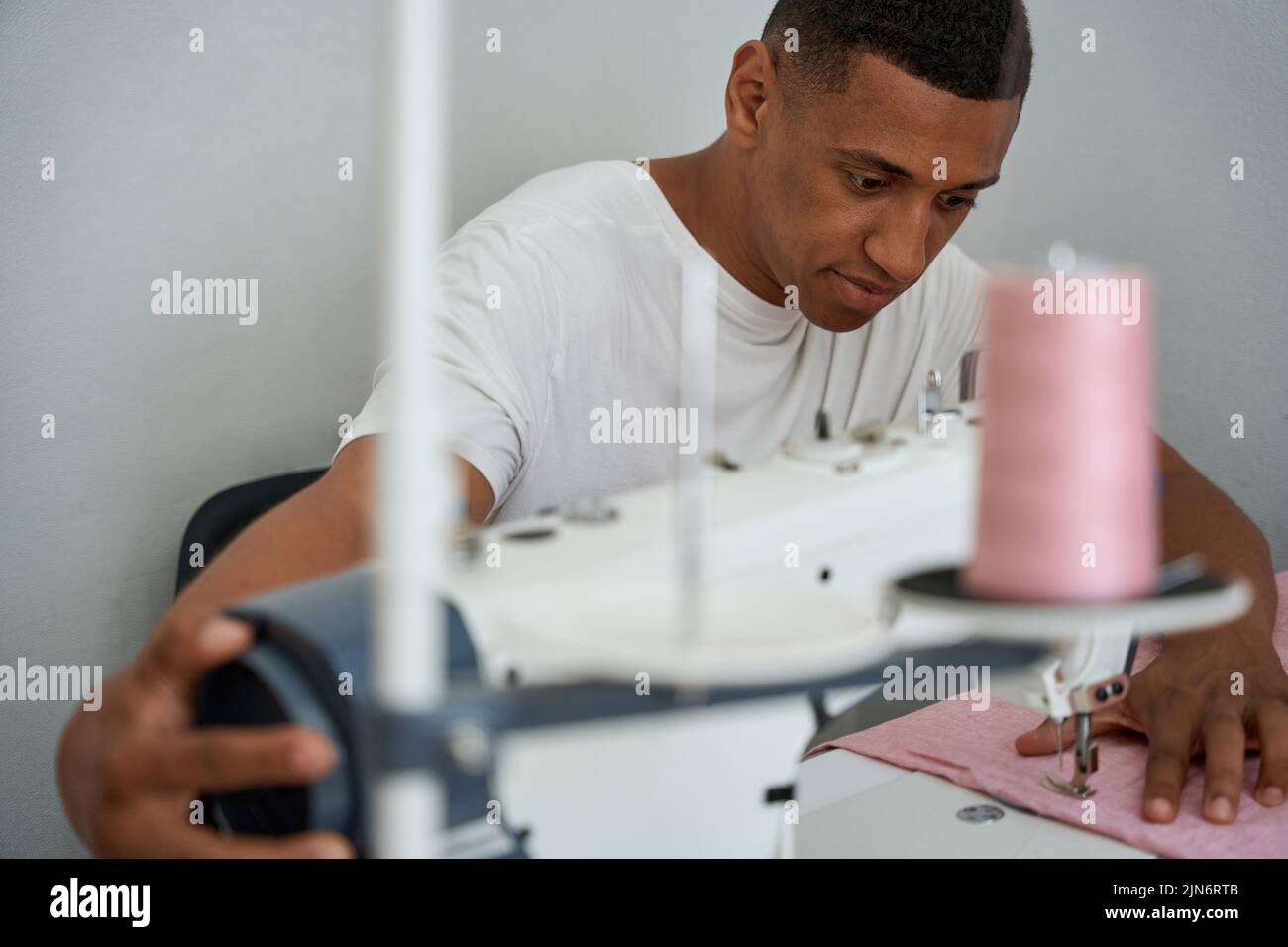 African American tailor making clothes in atelier Stock Photo