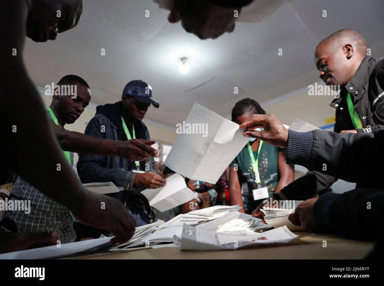 Electoral officials sort cast ballot papers during the general election conducted by the Independent Electoral and Boundaries Commission (IEBC) at the close of the voting process at the Moi Avenue Primary School in Nairobi, Kenya August 9, 2022. REUTERS/Thomas Mukoya Stock Photo
