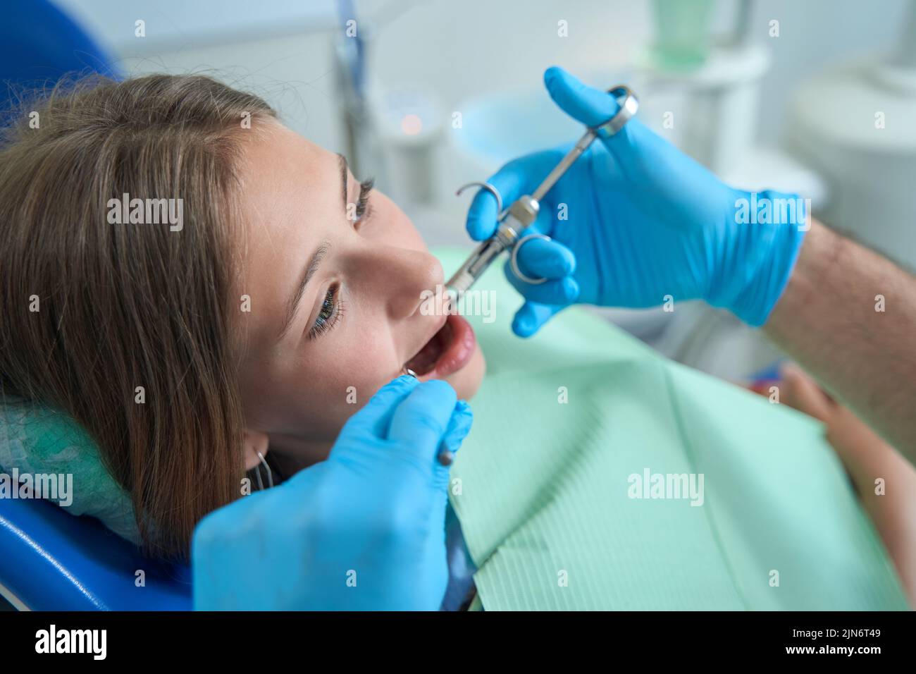 Teenage patient receiving anesthesia before dental procedure Stock