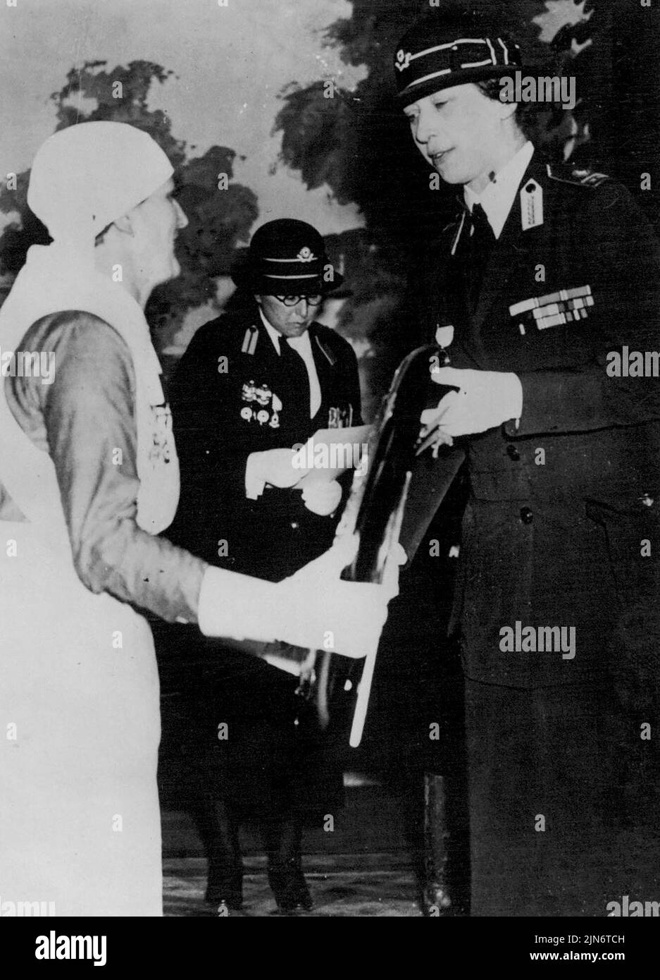 Princess Royal Presents Shield -- The Princess Royal, sister of King George, Presenting The Stanley shield to the winning team when she watched the nursing competitions at the Wharncliffe Rooms. May 05, 1938. (Photo by Keystone). Stock Photo