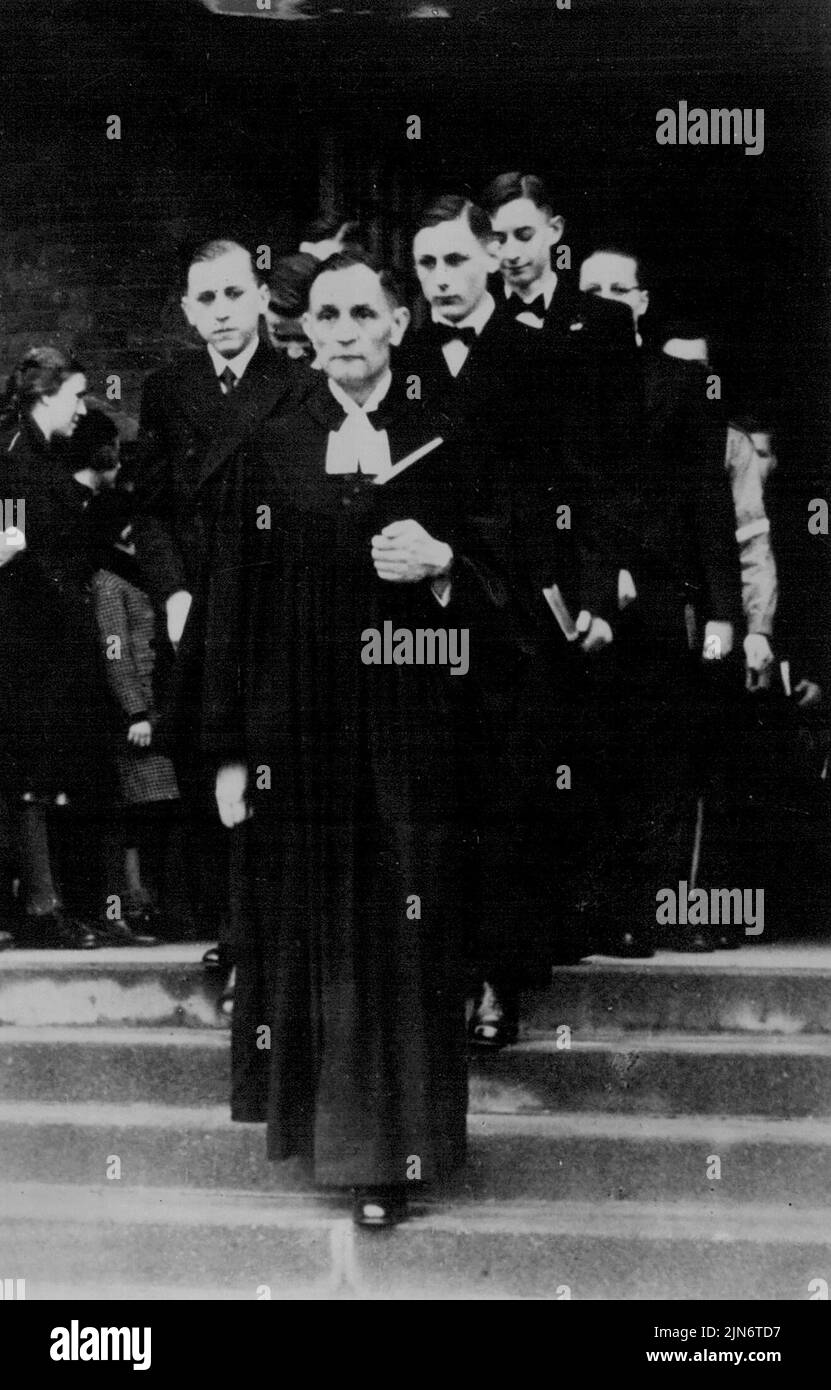 Pastor Niemoller leaving his last confirmation service. A Rare Picture Taken In 1937.Pastor Niemoller, victim of Nazi brutality, leaving Jesus Christus Kirche, Dahlem, at Easter 1937, after taking his last confirmation Service before his arrest and imprisonment in July of that year. March 01, 19452. Stock Photo