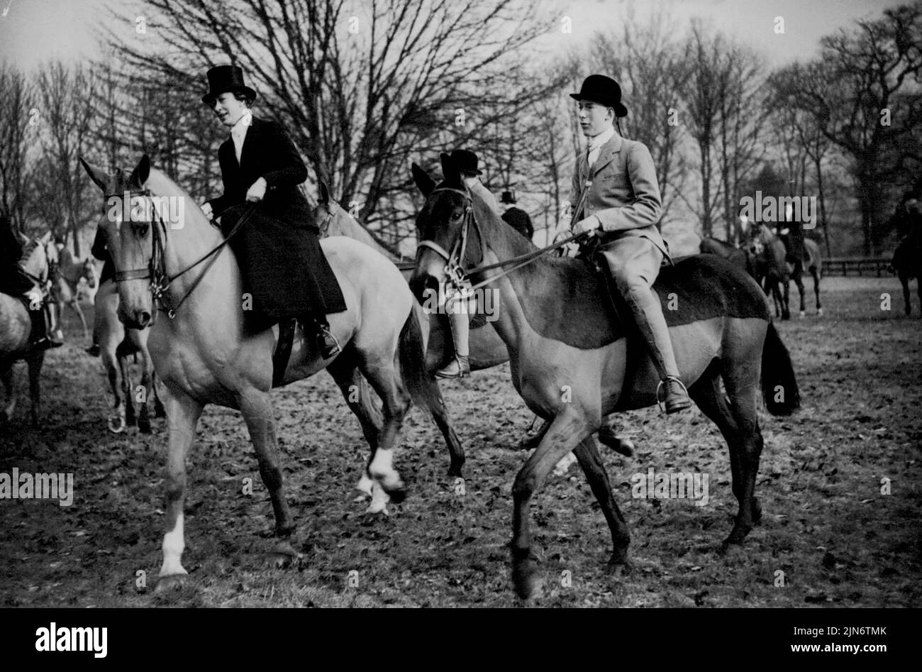 The King's Sister Hunts With Her Son -- H.R.H. The Princess Royal, only sister of King George VI., is seen riding with her elder son, Lord Lascelles when they took part in the Bramham Moor meet at Spofforth, near here today. The Princess Royal., who was formerly Princess Mary, is married to The Earl of Harewood. February 22, 1938. (Photo by Associated Press Photo). Stock Photo