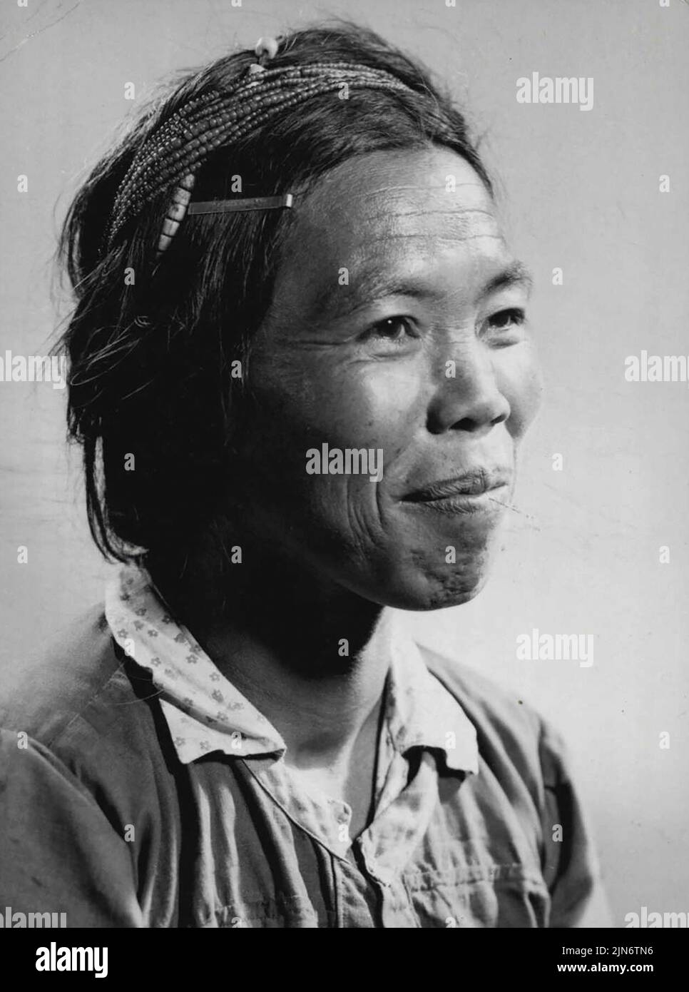 Igorot woman of the Mountain Province porch Luzon. March 04, 1954. (Photo by Chas. W. Miller). Stock Photo