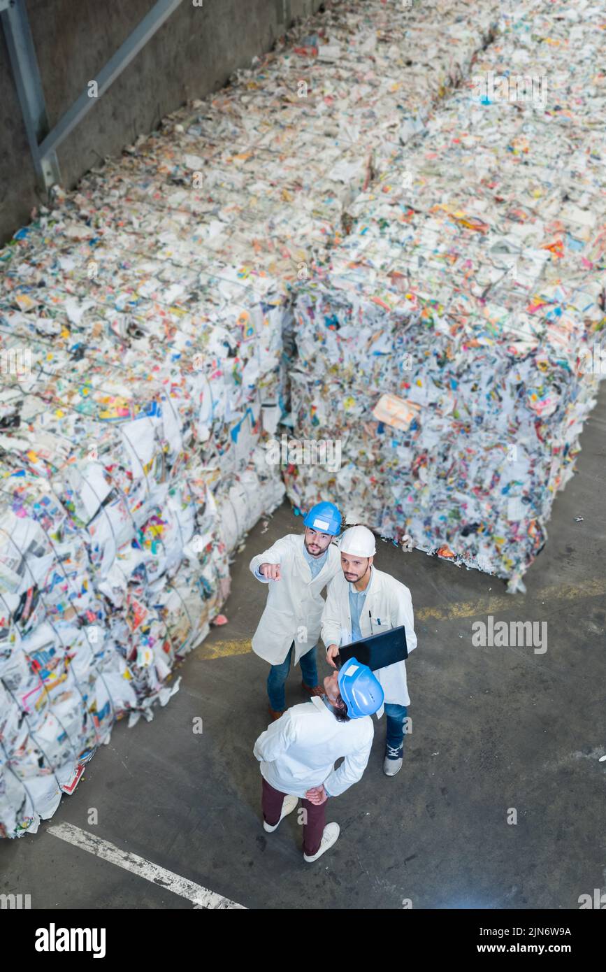 sanitation workers working in recycling plant Stock Photo