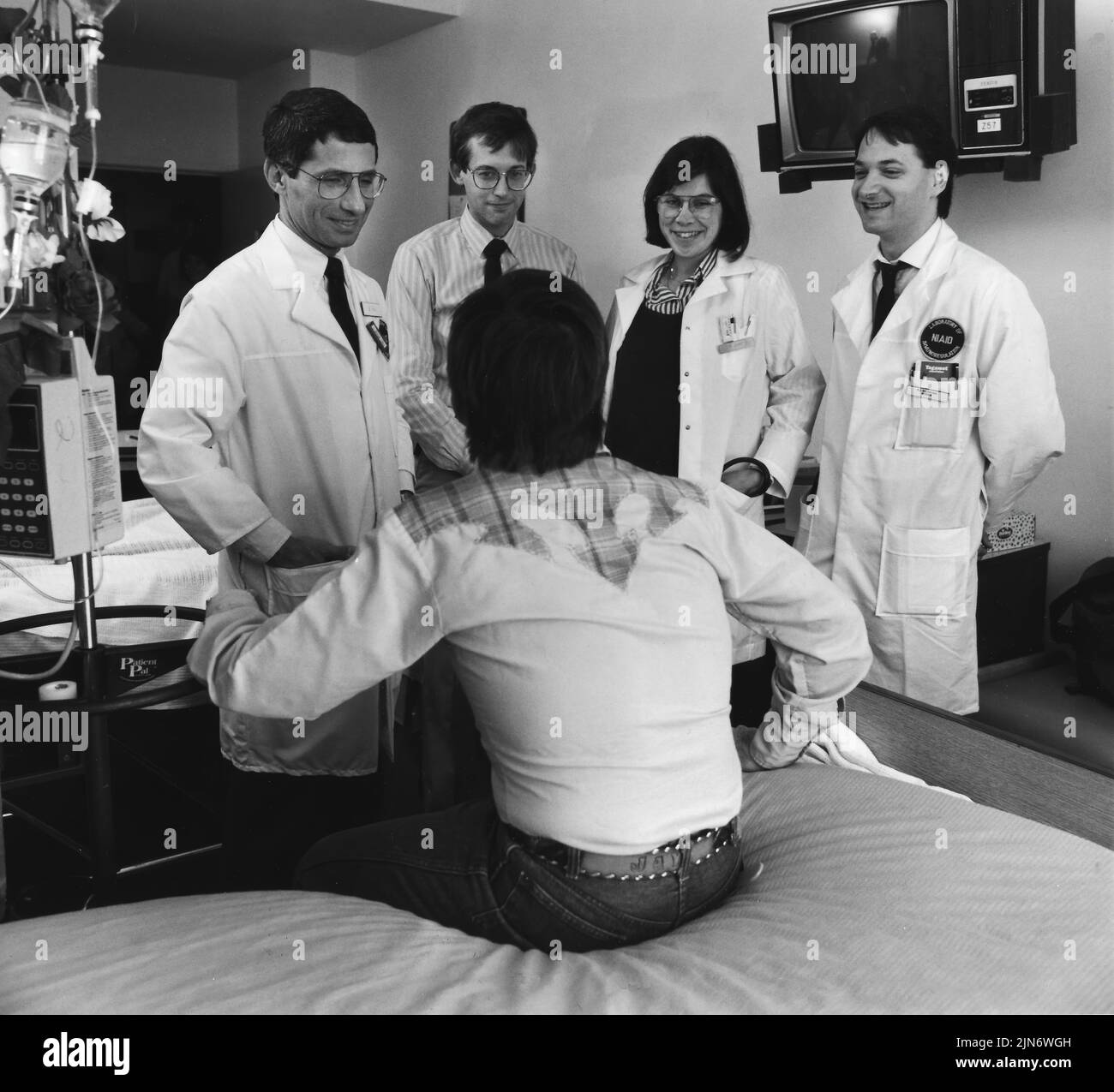 Anthony Fauci During the Early Years of the AIDS Epidemic Dr. Anthony Fauci and treatment team with an early AIDS patient at NIH, 1987. Credit: NIAID Stock Photo