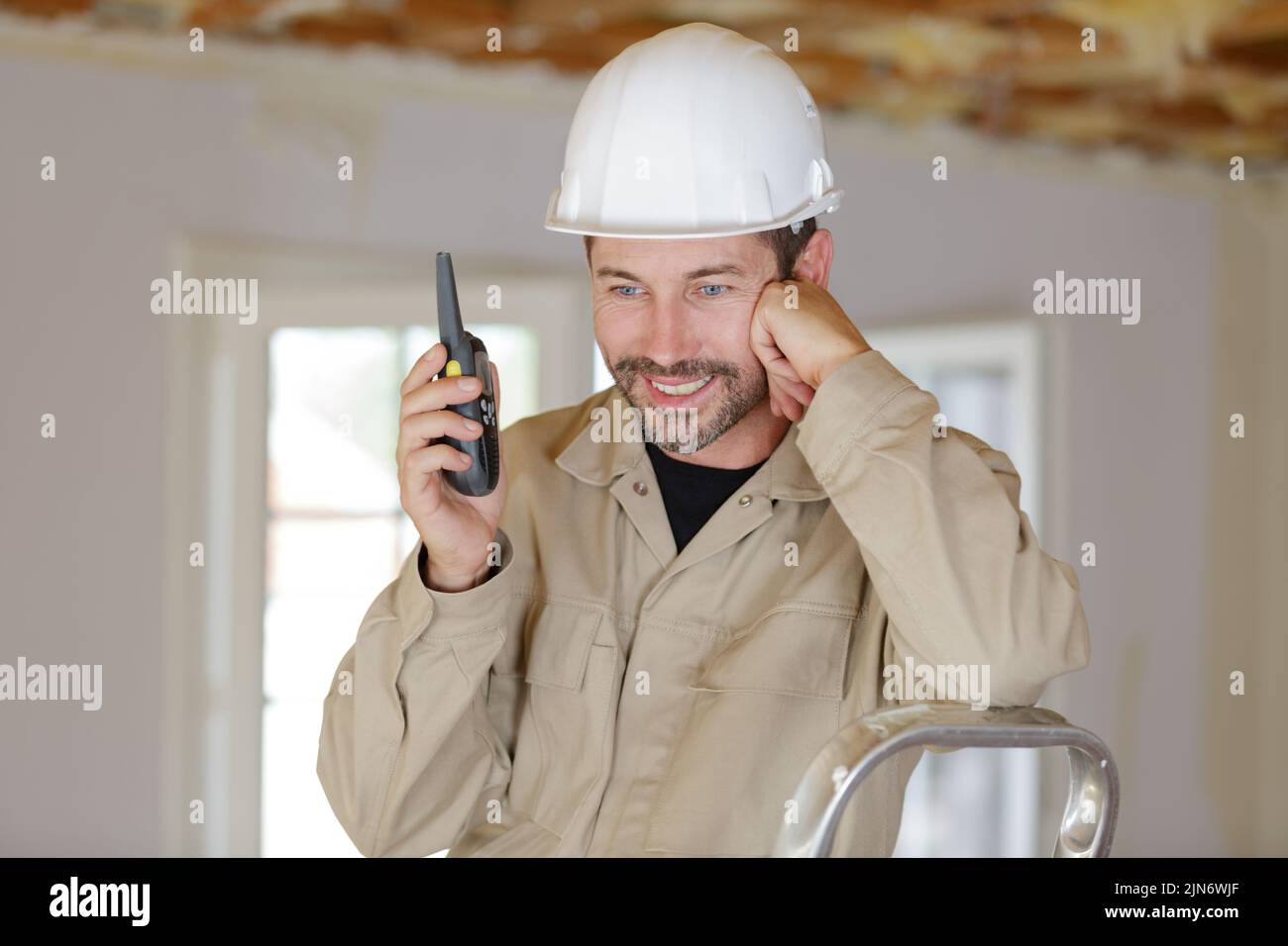 foreman on site using walkie talkie Stock Photo