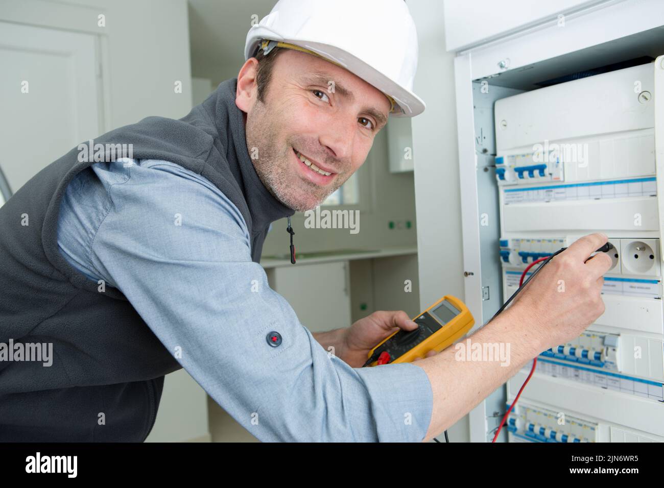 electrician testing circuit breaker with multimeter Stock Photo Alamy