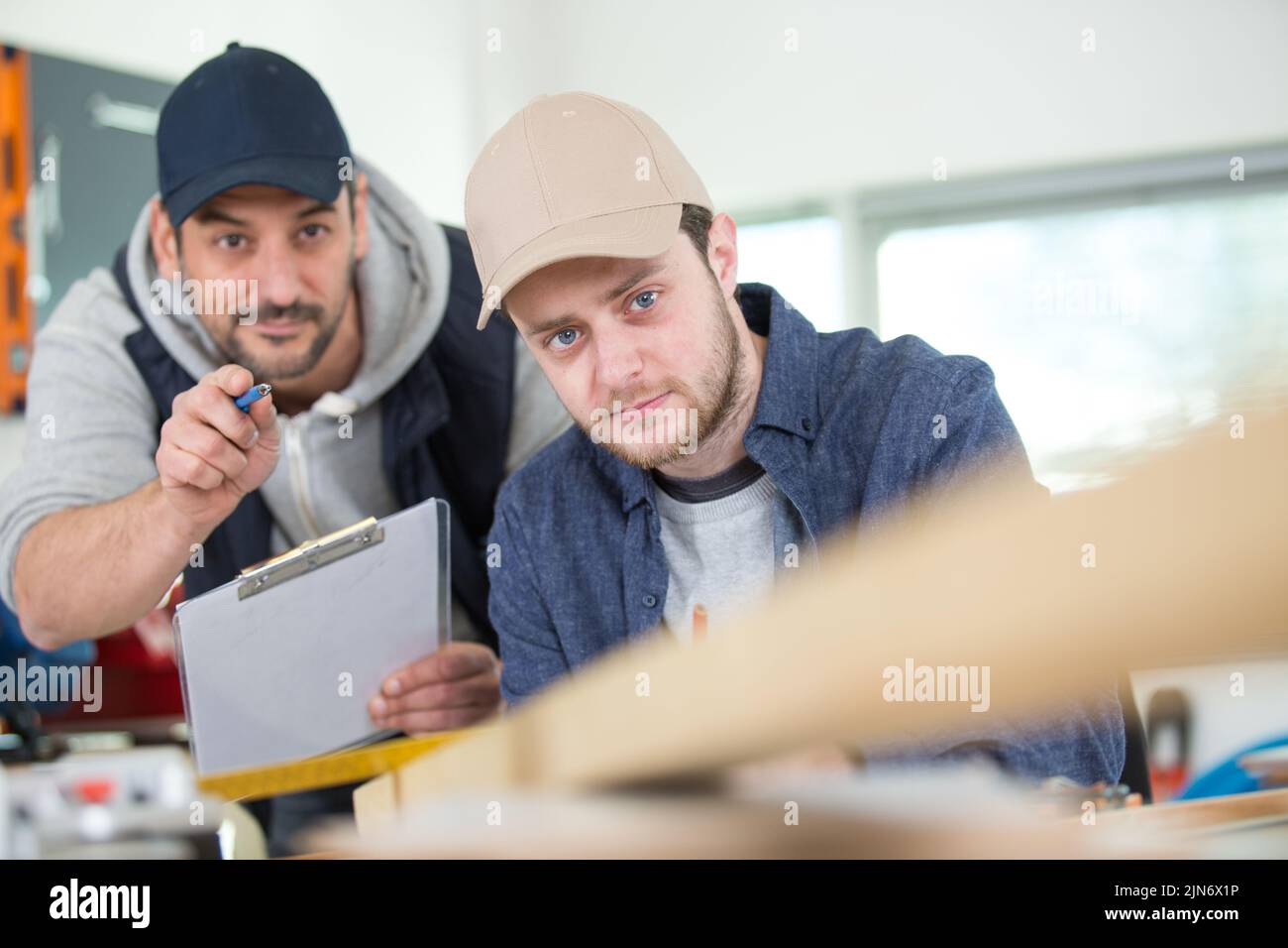 two wood designer working in workshop Stock Photo