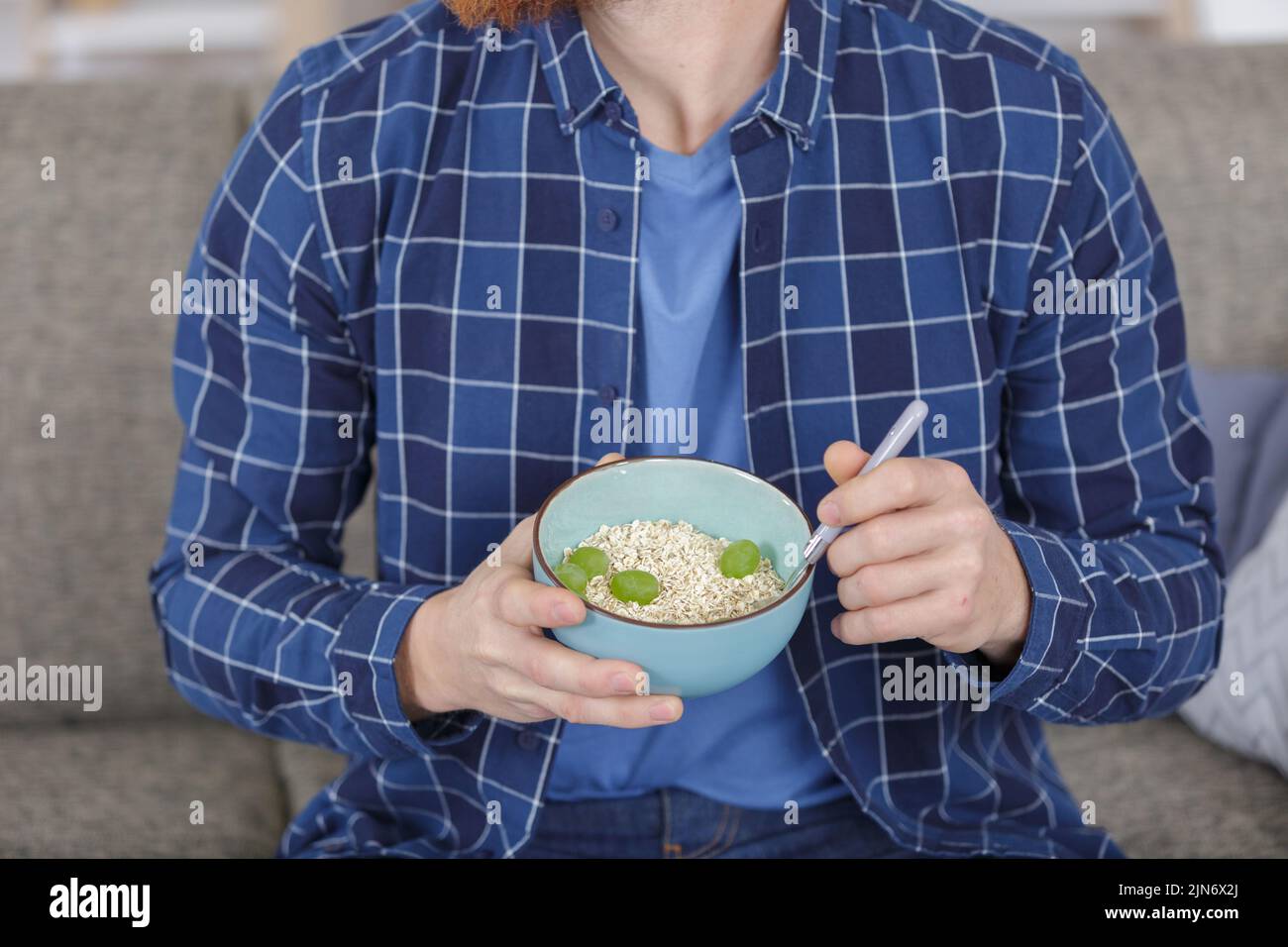 a man is eating rice Stock Photo