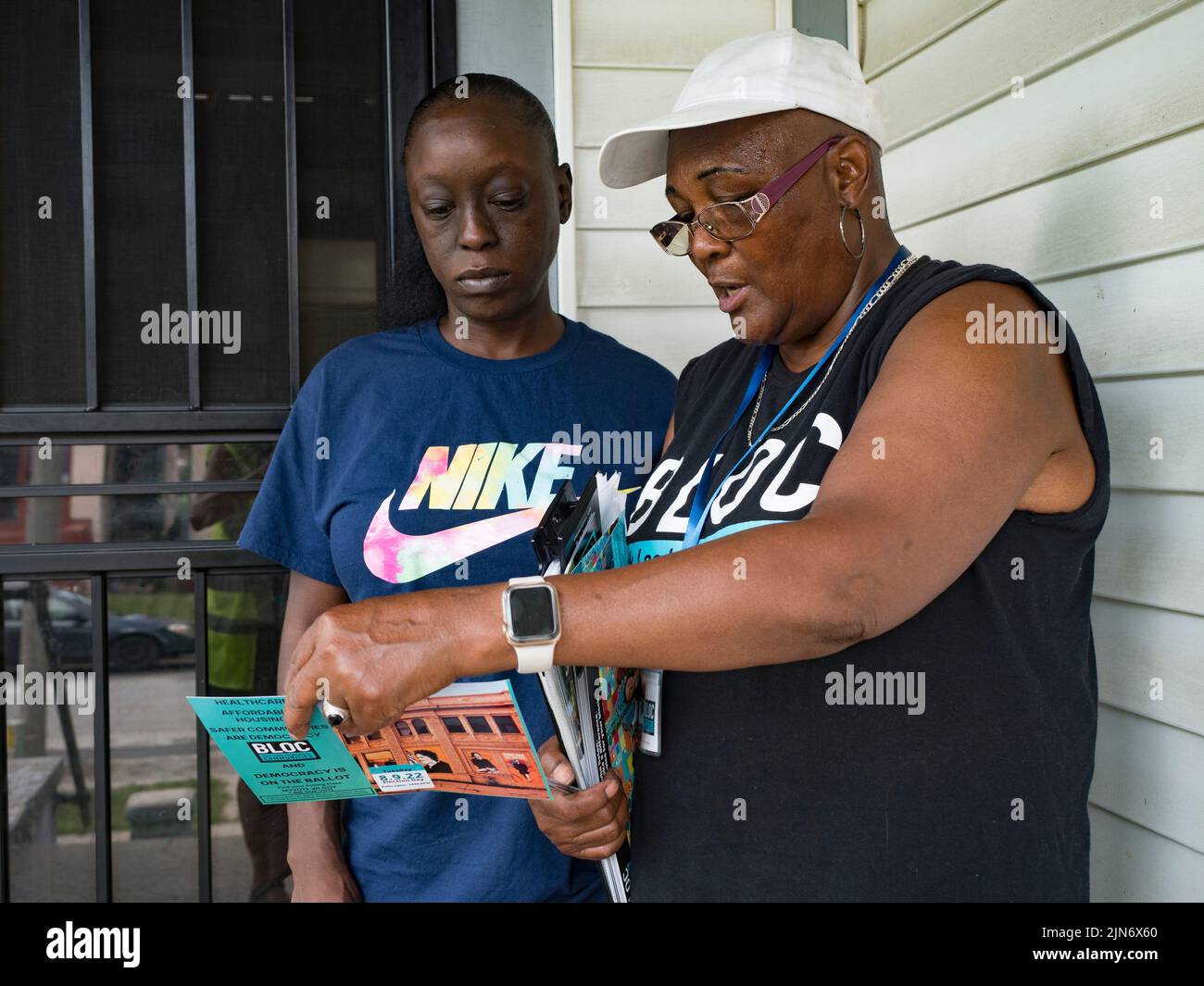 Milwaukee, Wisconsin, USA. 7th Aug, 2022. Community organizer Anita Winston talks with voter Tyonia Lyons about the candidates that BLOC, Black Leaders Organizing for Communities, has endorsed in WisconsinÃs Partisan Primary Election. (Credit Image: © Sue Dorfman/ZUMA Press Wire) Stock Photo