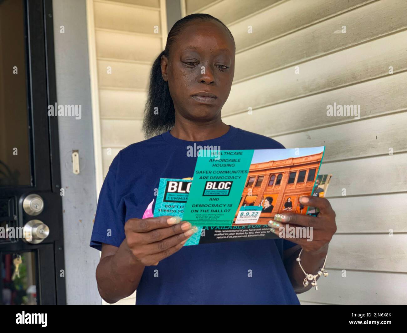 Milwaukee, Wisconsin, USA. 7th Aug, 2022. Voter Tyonia Lyons reviews literature from BLOC, Black Leaders Organizing for Communities, as part of that organizationÃs efforts to get people to the polls for WisconsinÃs Primary Election. (Credit Image: © Sue Dorfman/ZUMA Press Wire) Stock Photo