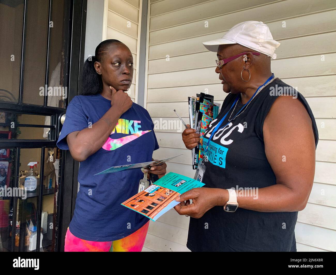 Milwaukee, Wisconsin, USA. 7th Aug, 2022. Community organizer Anita Winston talks with voter Tyonia Lyons about the candidates that BLOC, Black Leaders Organizing for Communities, has endorsed in WisconsinÃs Partisan Primary Election. (Credit Image: © Sue Dorfman/ZUMA Press Wire) Stock Photo